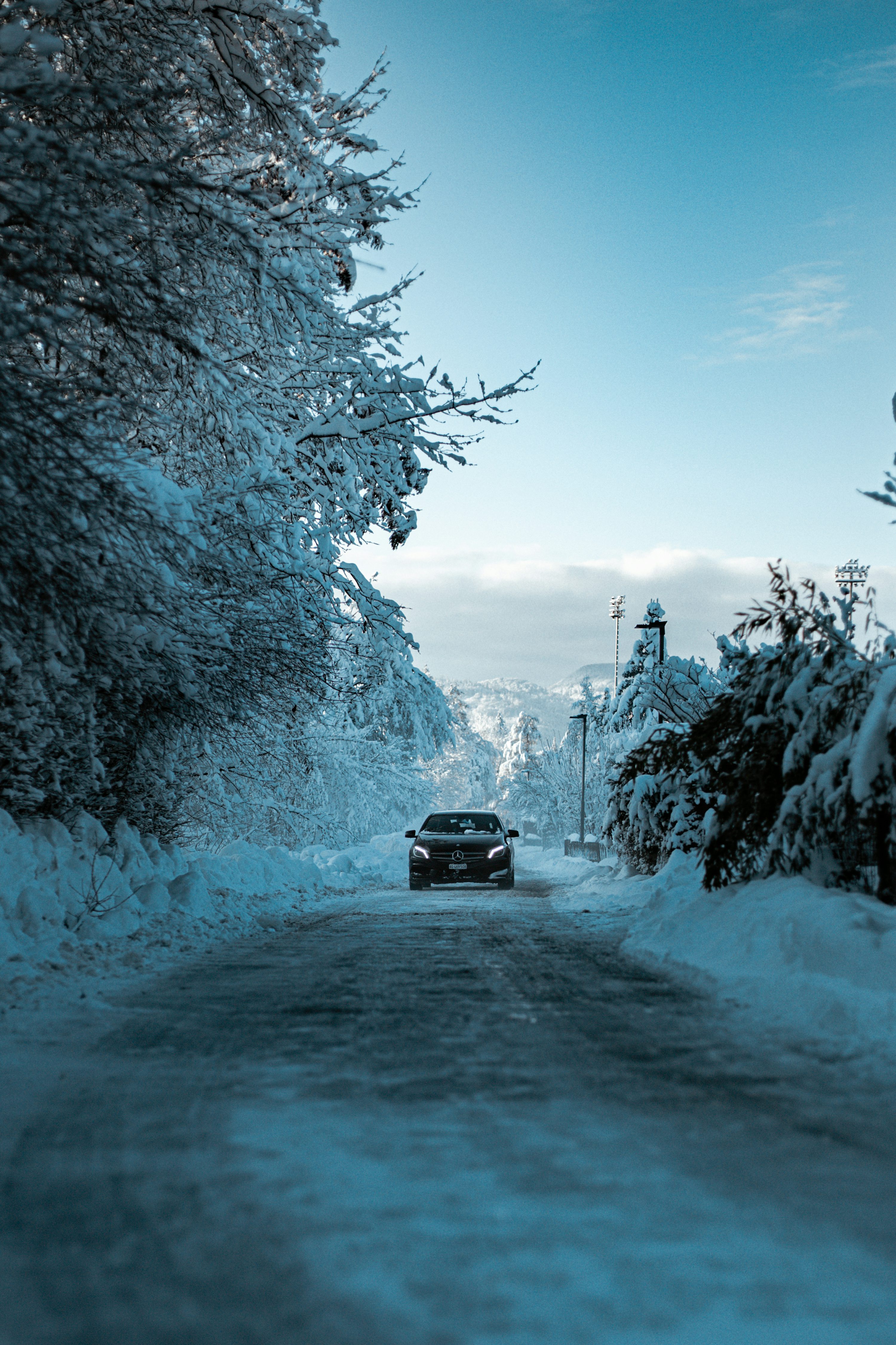 Black suv on snow covered road during daytime photo