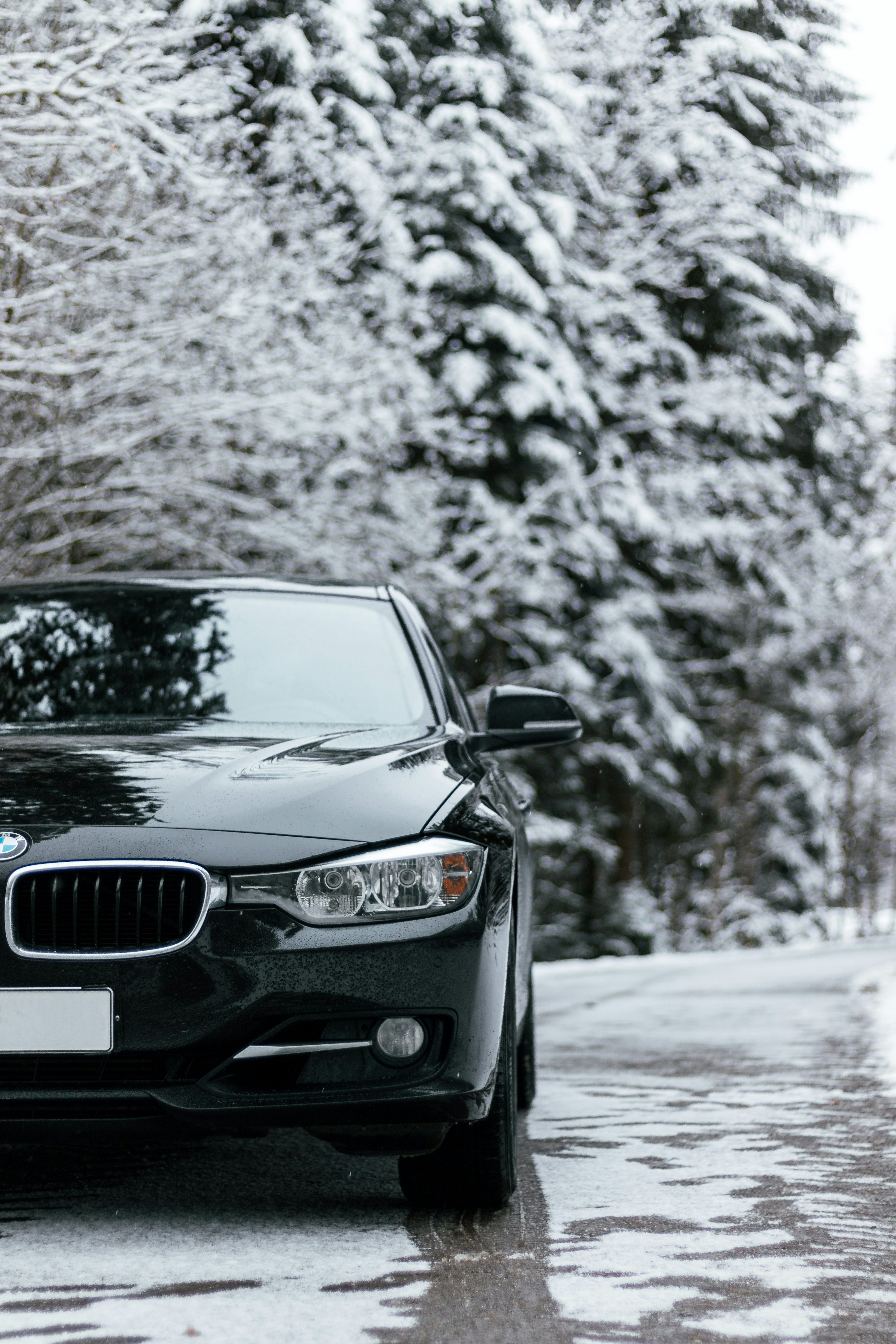 Black mercedes benz car on snow covered road photo