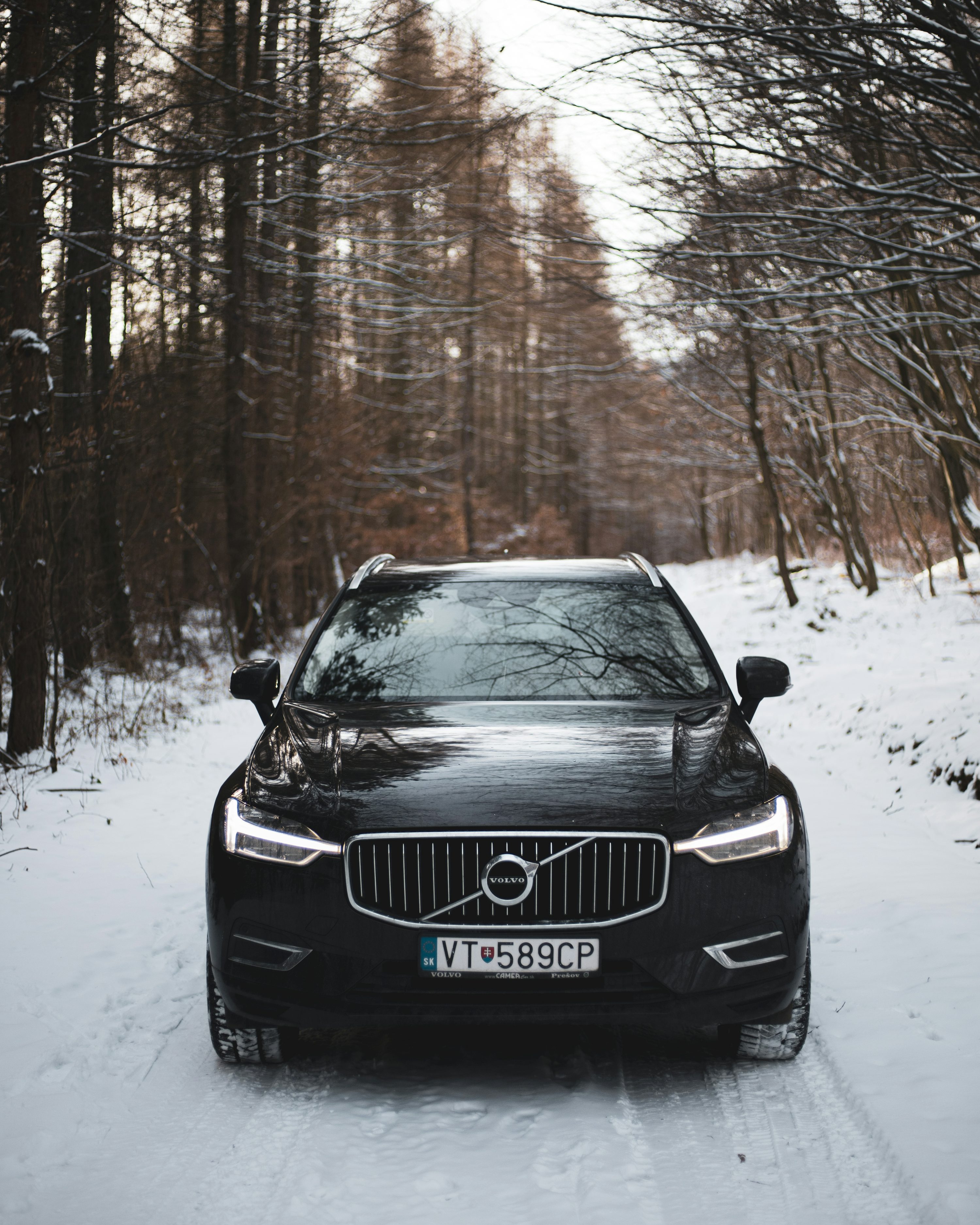 A volvo car parked on a snowy road photo