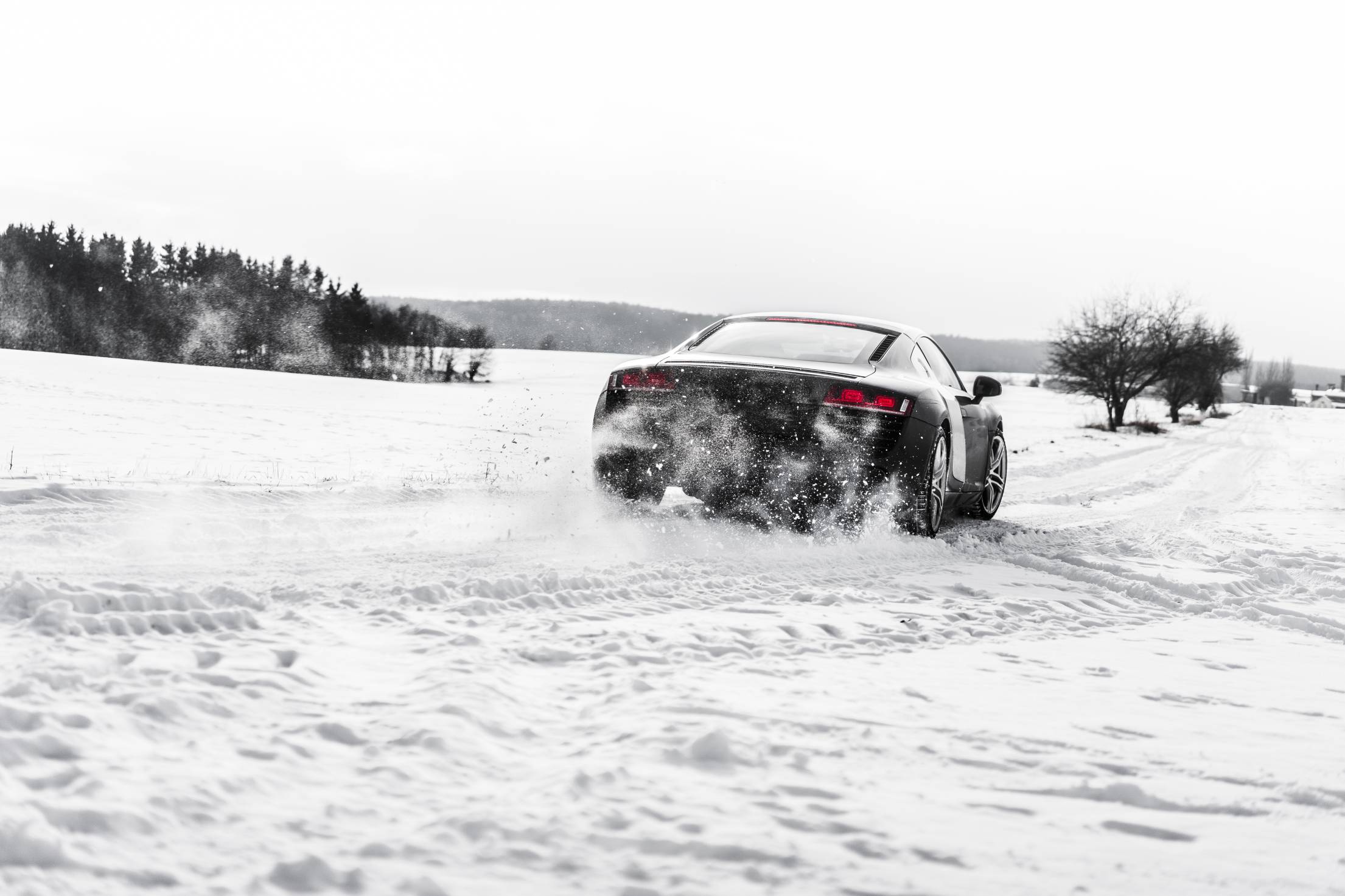 Supercar Drifting on a Snow Covered Road. Free Car Photo