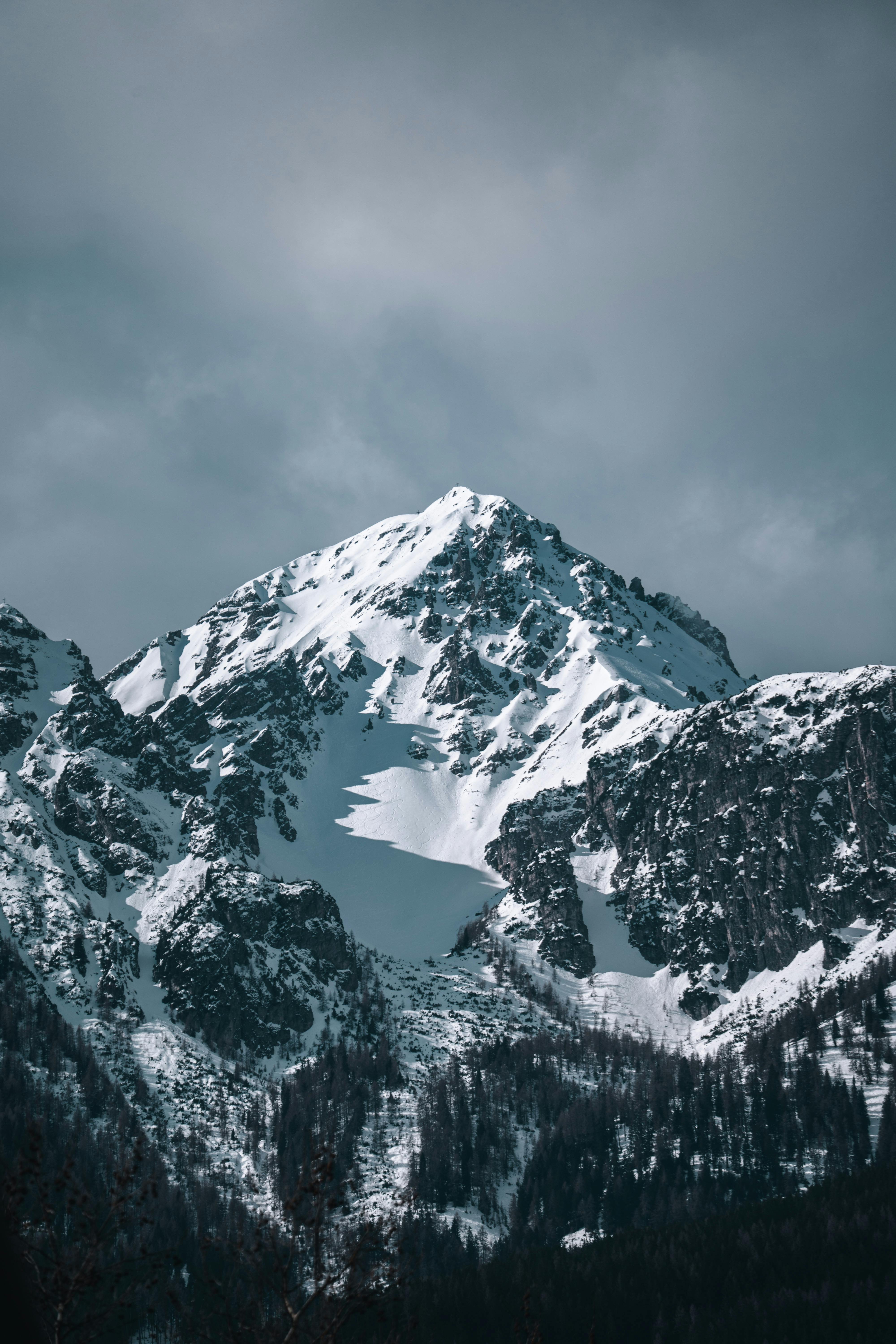 Majestic Snow Covered Mountain Peak In Winter · Free
