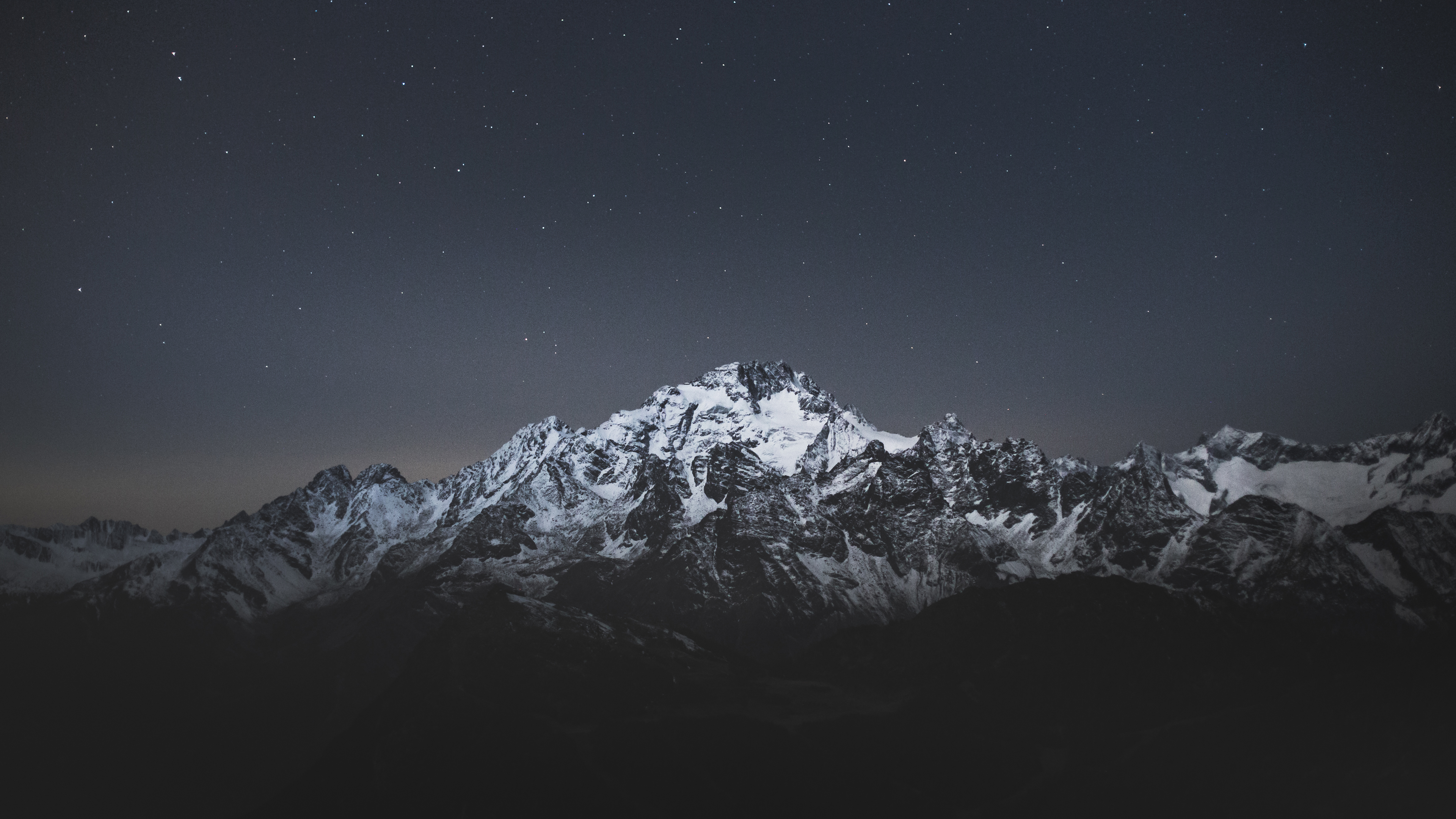 White Snow Covered Mountains Under Black Starry Sky 4K HD Nature Wallpaper