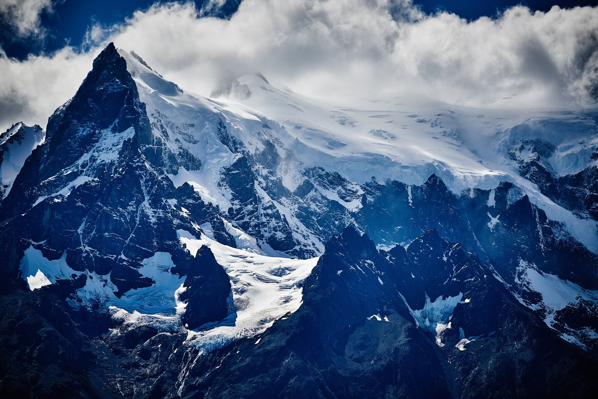 8K Ultra HD Snow Capped Mountain Peak Above The Clouds