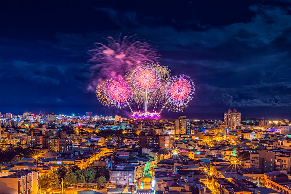 Fireworks Display over City Buildings during Night Time · Free