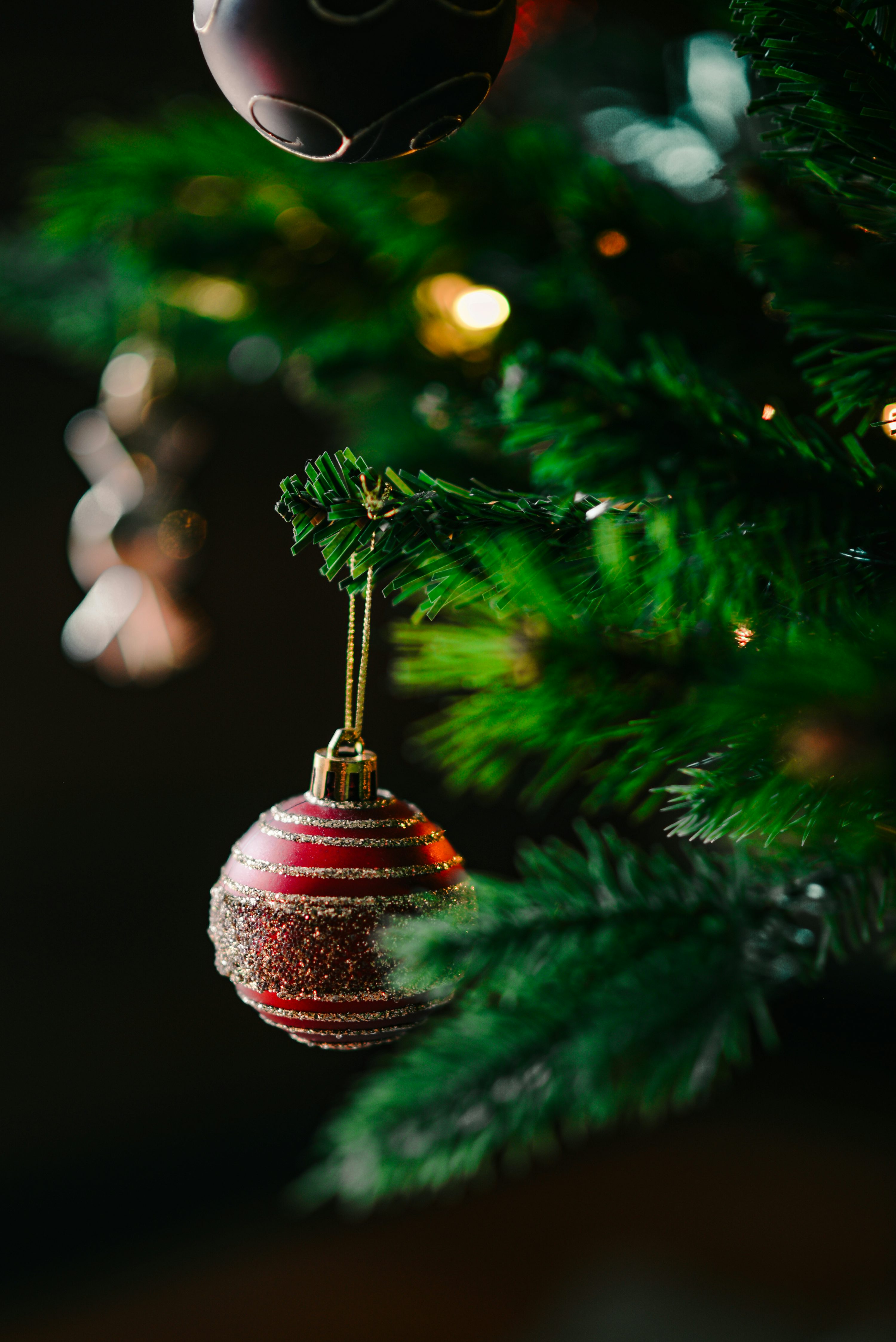 A christmas ornament hanging from a christmas tree photo