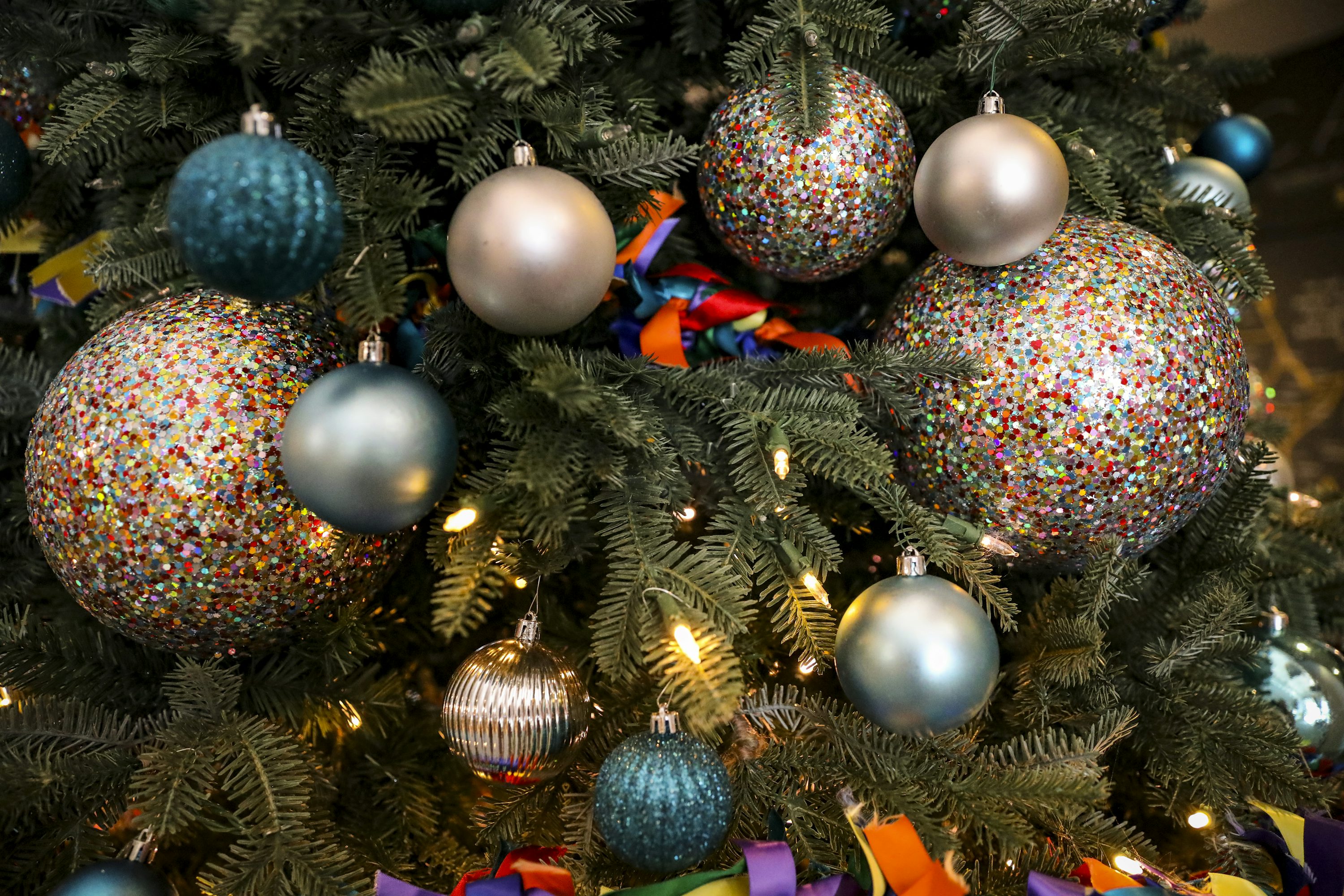 A close up of a christmas tree with ornaments photo