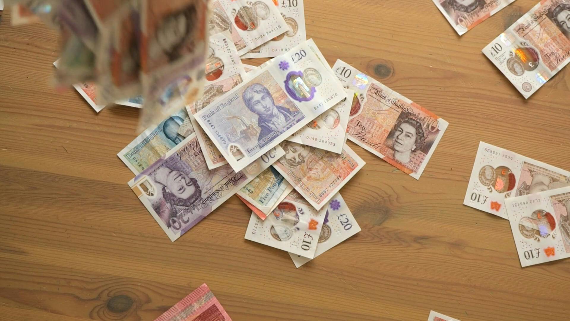 British Pound Falling On A Surface Free Stock Video Footage, Royalty Free 4K & HD Video Clip