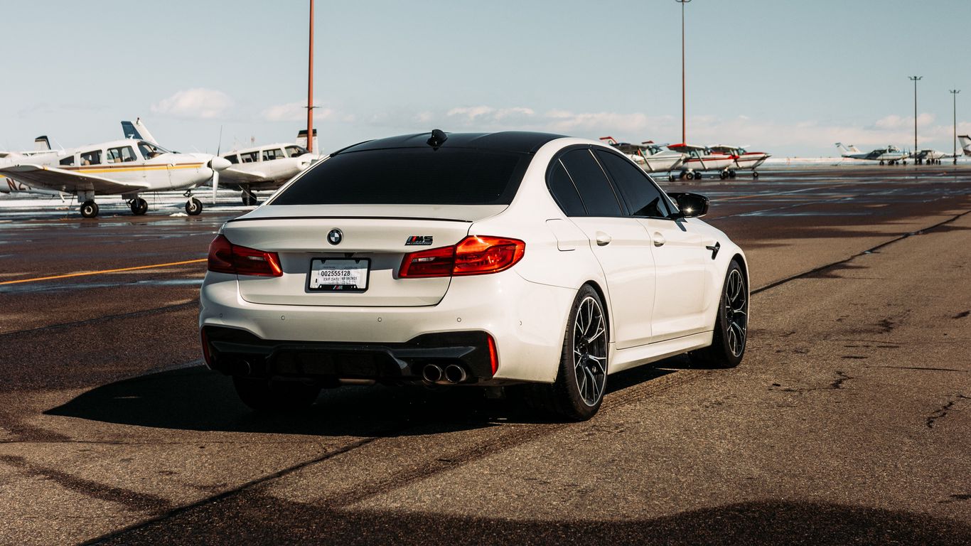 Download wallpaper 1366x768 bmw m5, bmw, car, white, airport tablet, laptop HD background