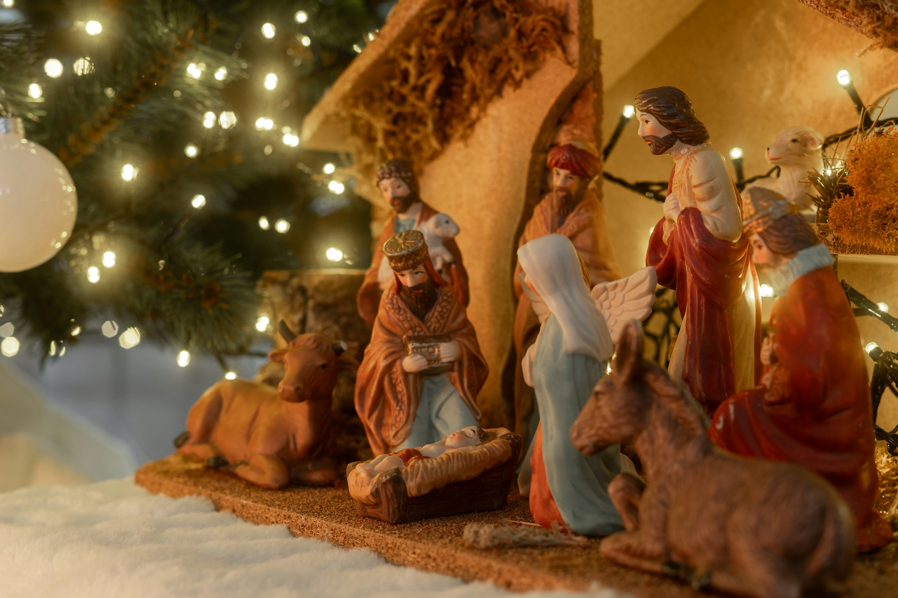 Christmas nativity scene with figures and lights photo