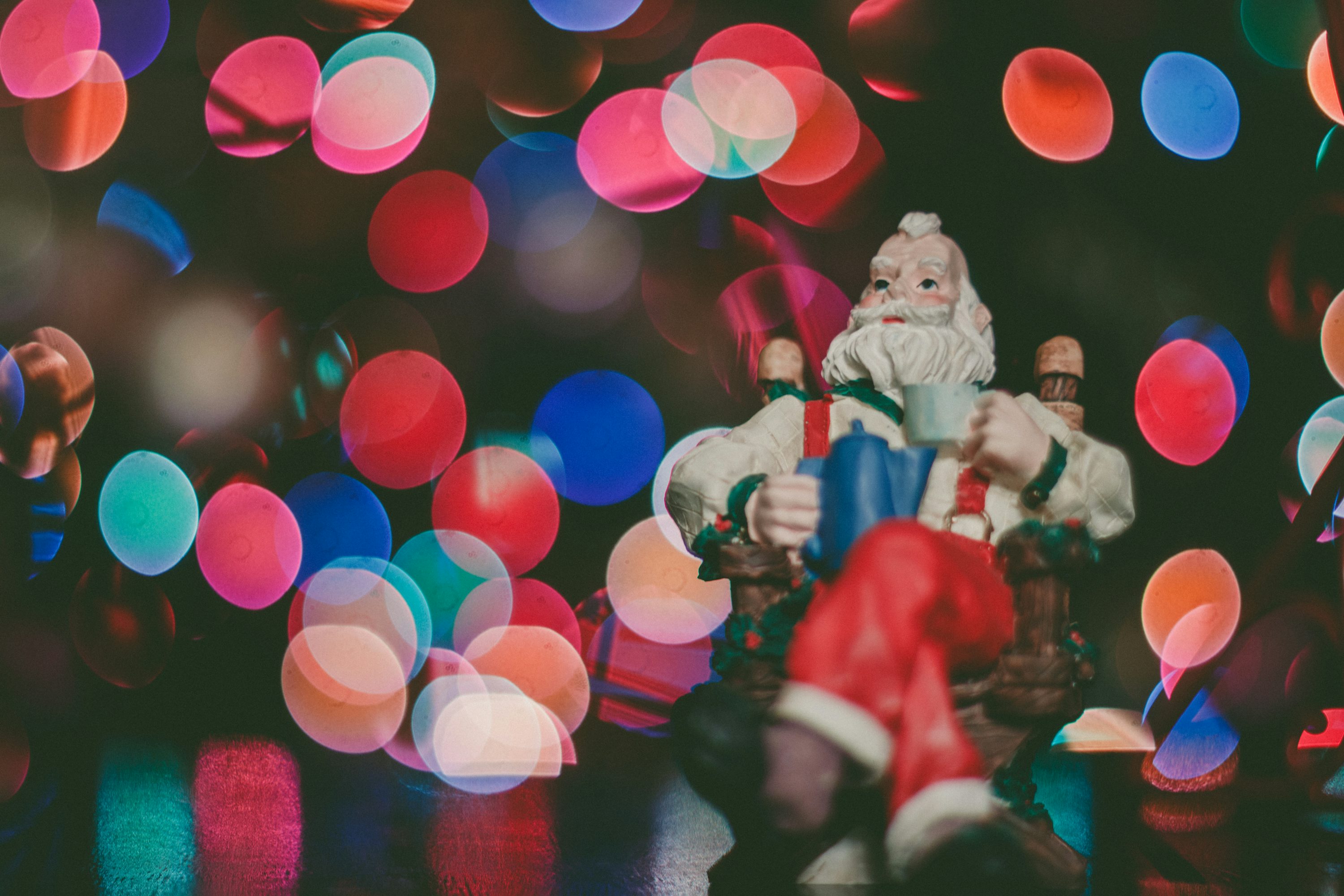 Macro photography of Santa Claus figurine on top of surface photo