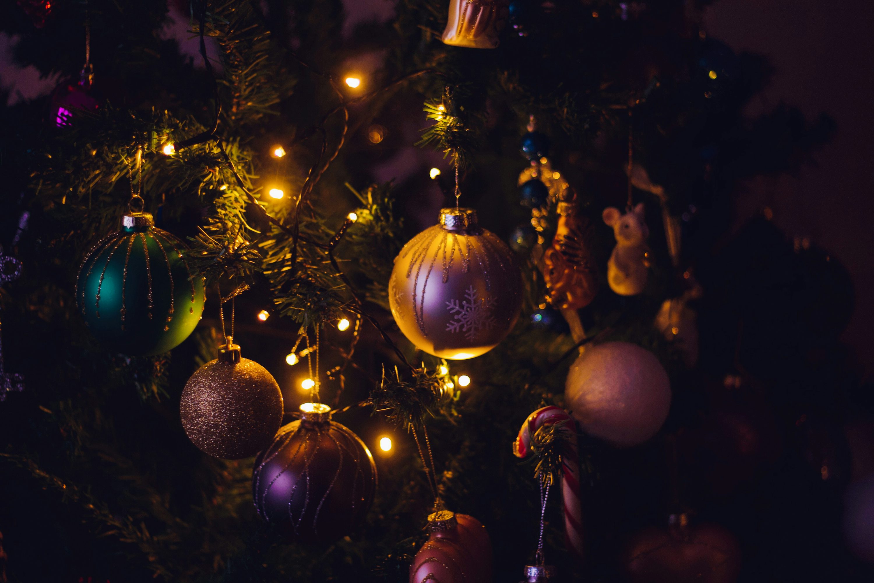 Macro photography of baubles near strings lights photo