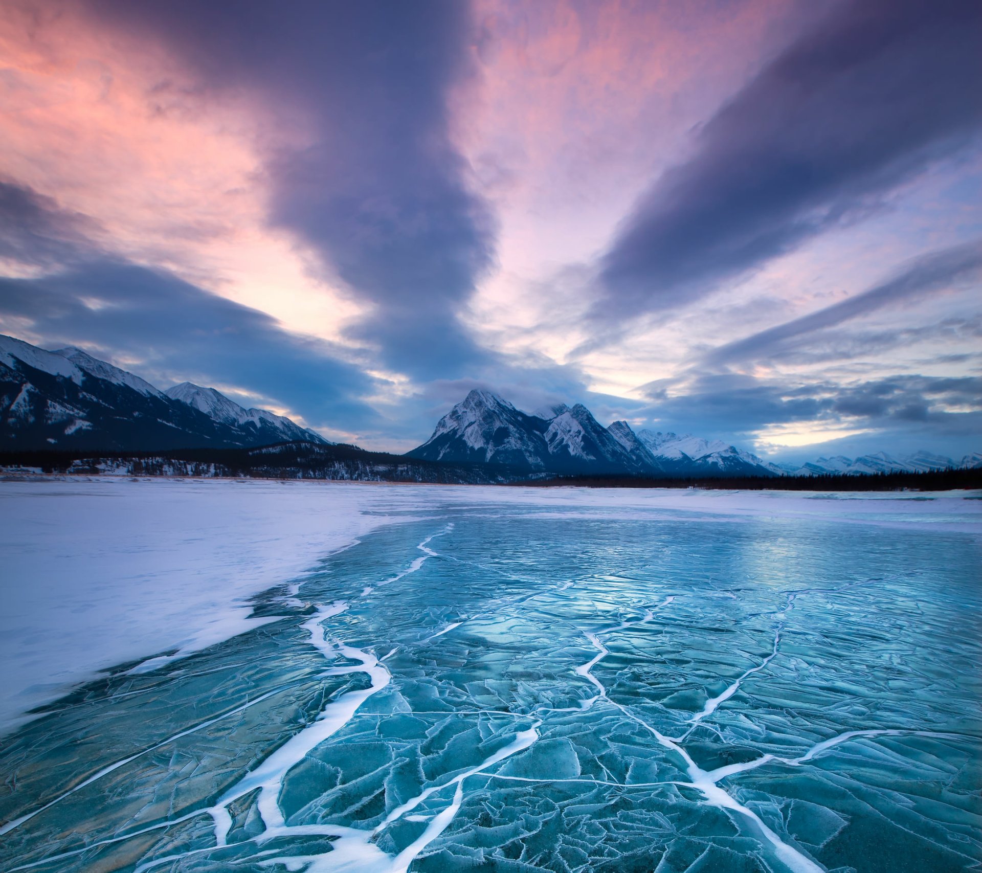 Frozen Mountain Lake at Winter Sunset