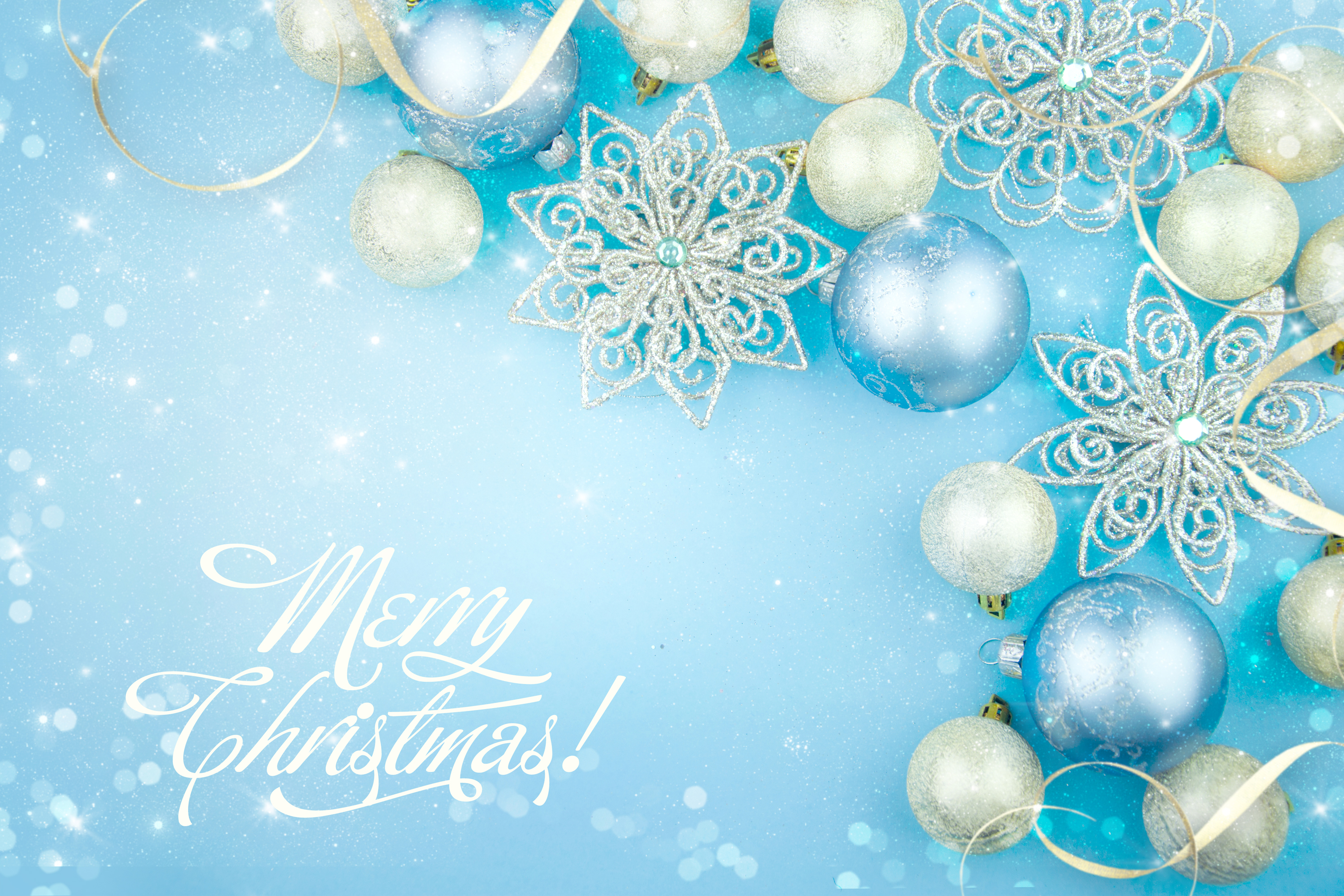 Beautiful Christmas decorations on a blue background with an inscription Merry Christmas. Desktop wallpaper 1920x1080