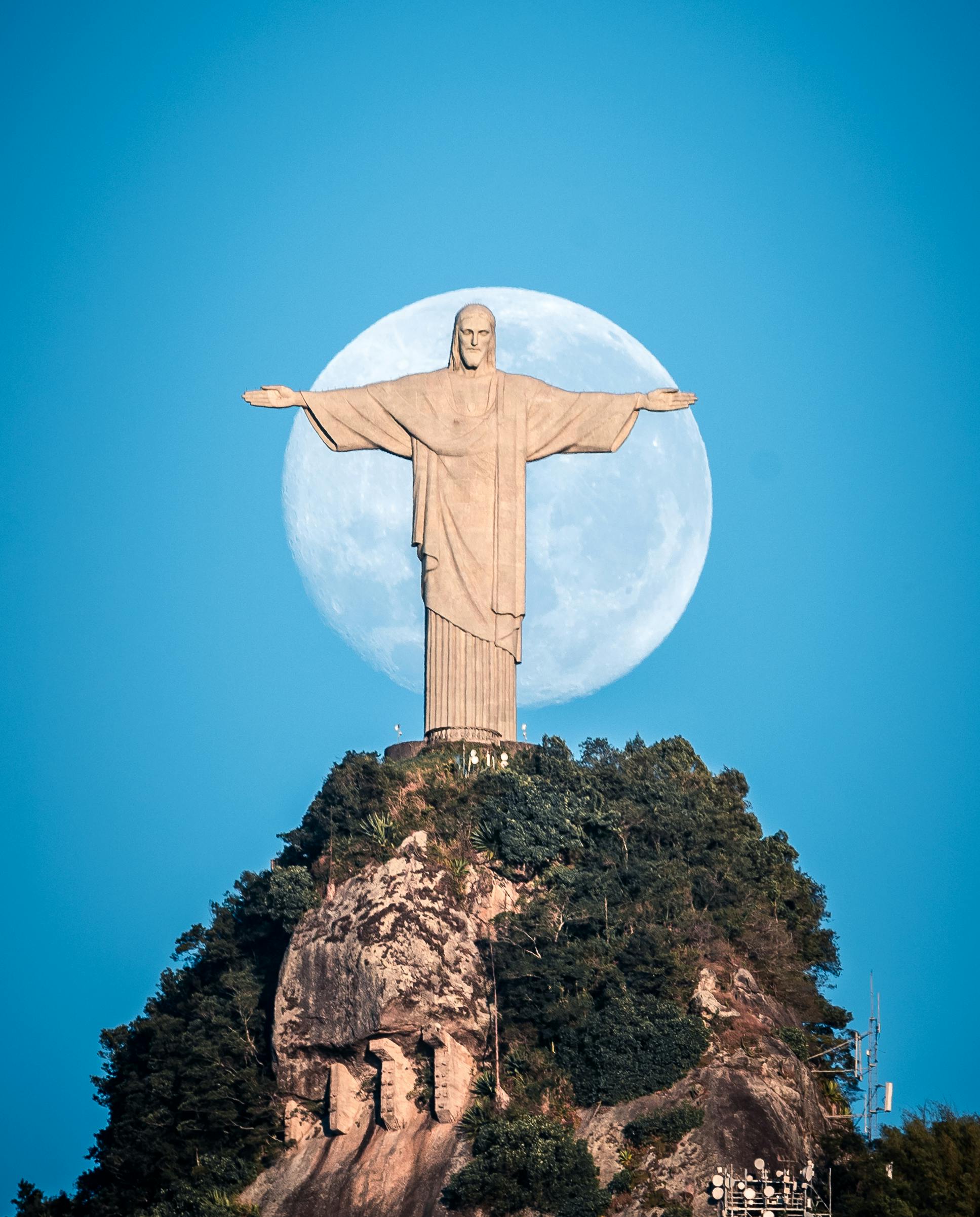 Statue of Jesus with the Moon in the Background · Free