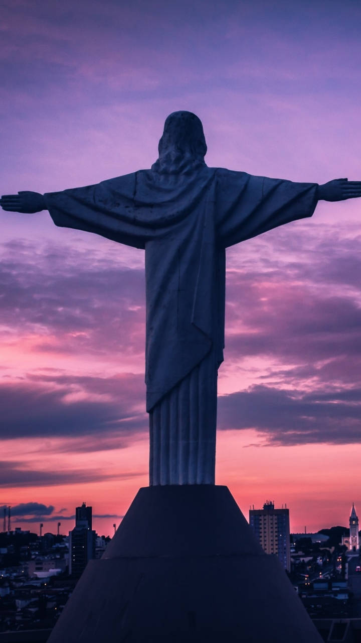 Download Redeemer Sculpted Statue Jesus Phone Wallpaper