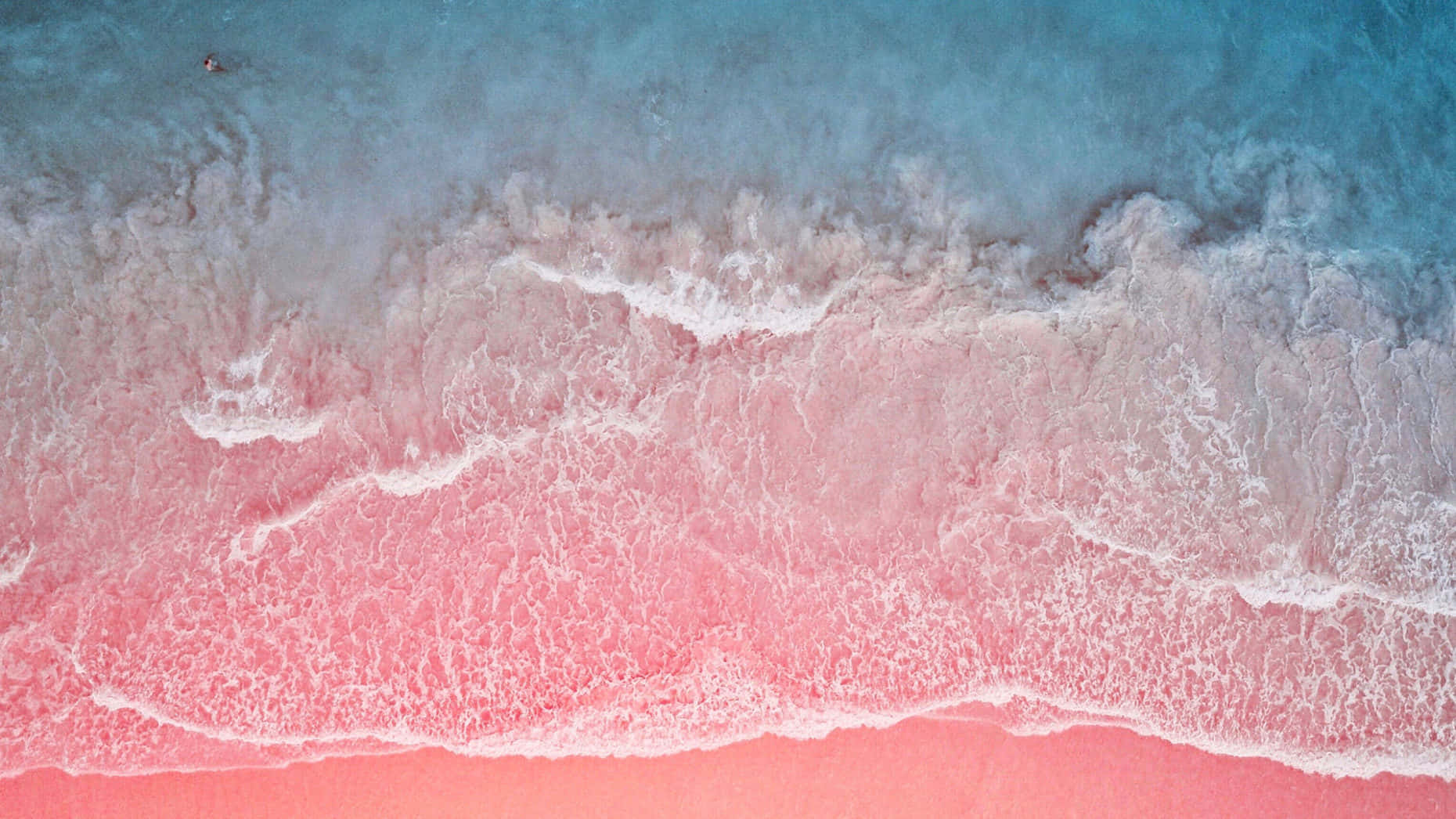 Download A breathtaking view of the stunning Pink Sand Beach Wallpaper