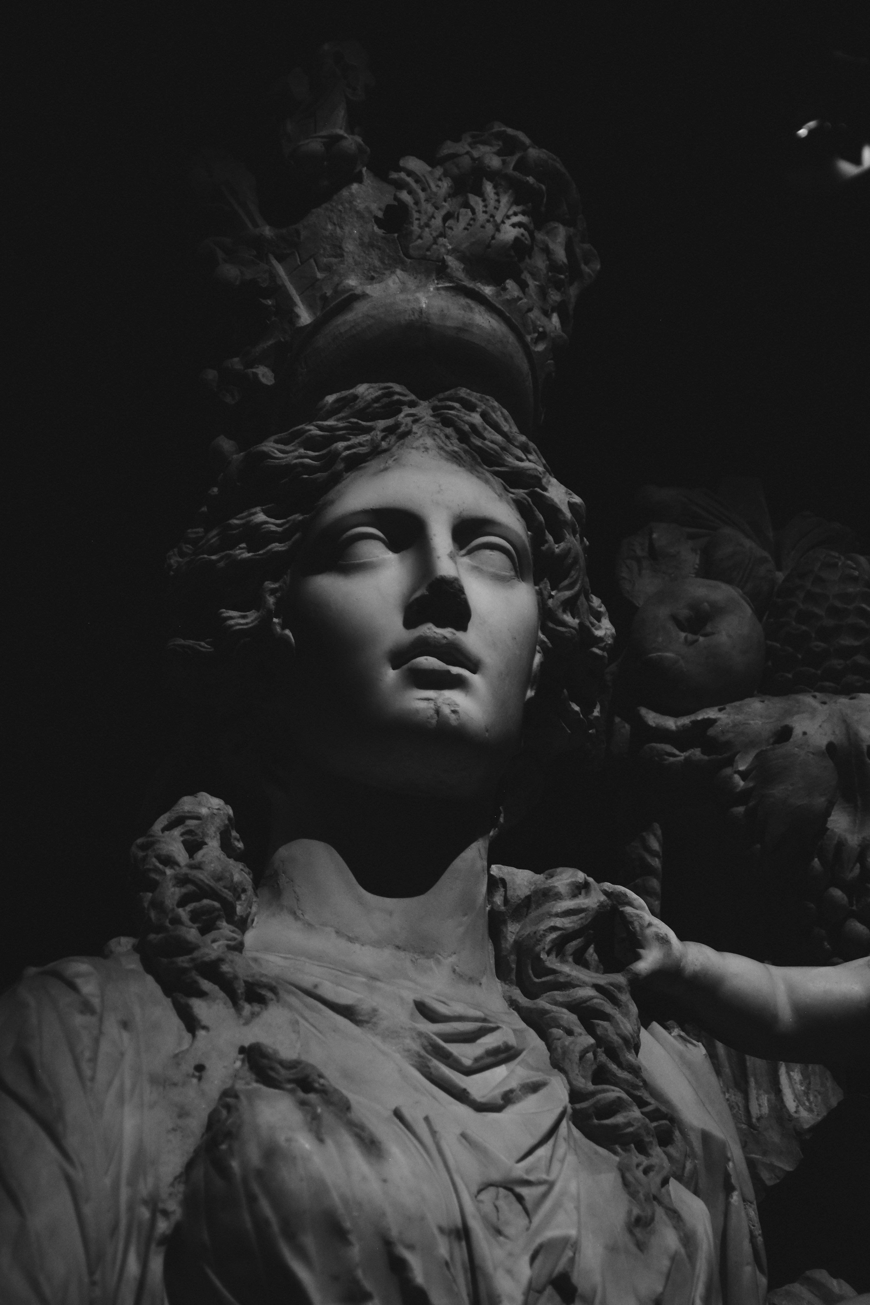 A black and white photo of a statue of a woman photo