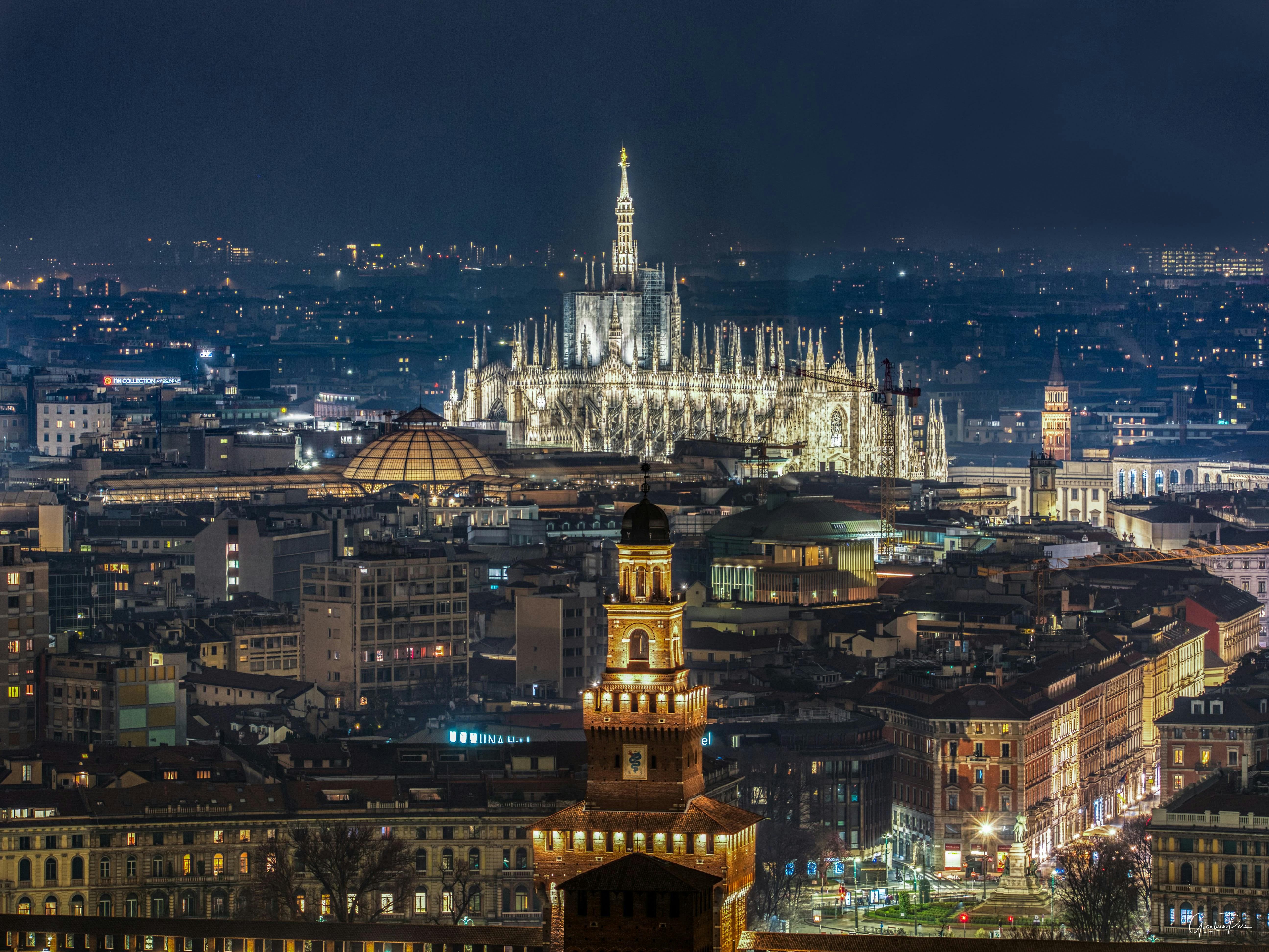 Milan Cathedral over City at Night · Free