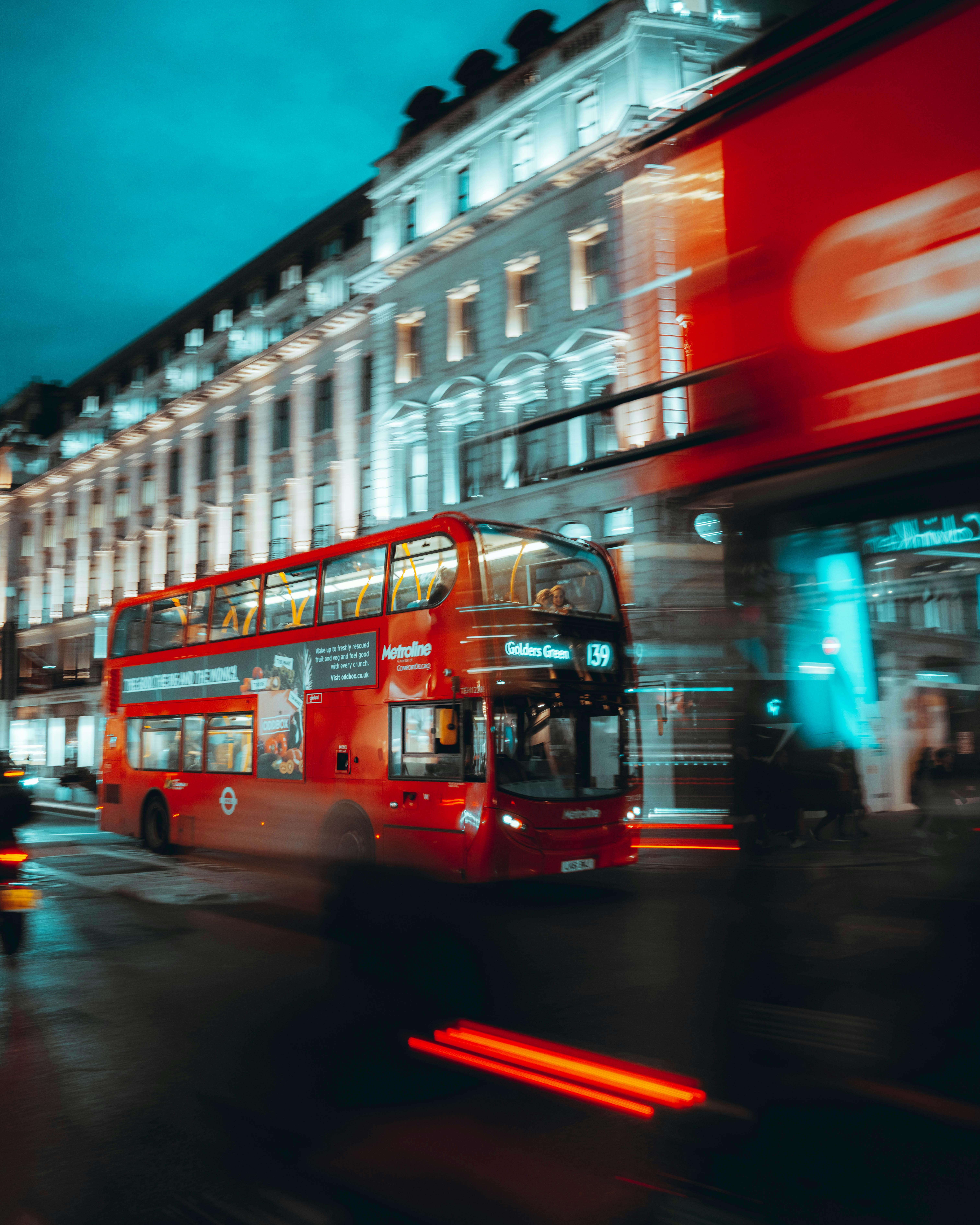 Red Double Decker Bus Moving at night in London · Free