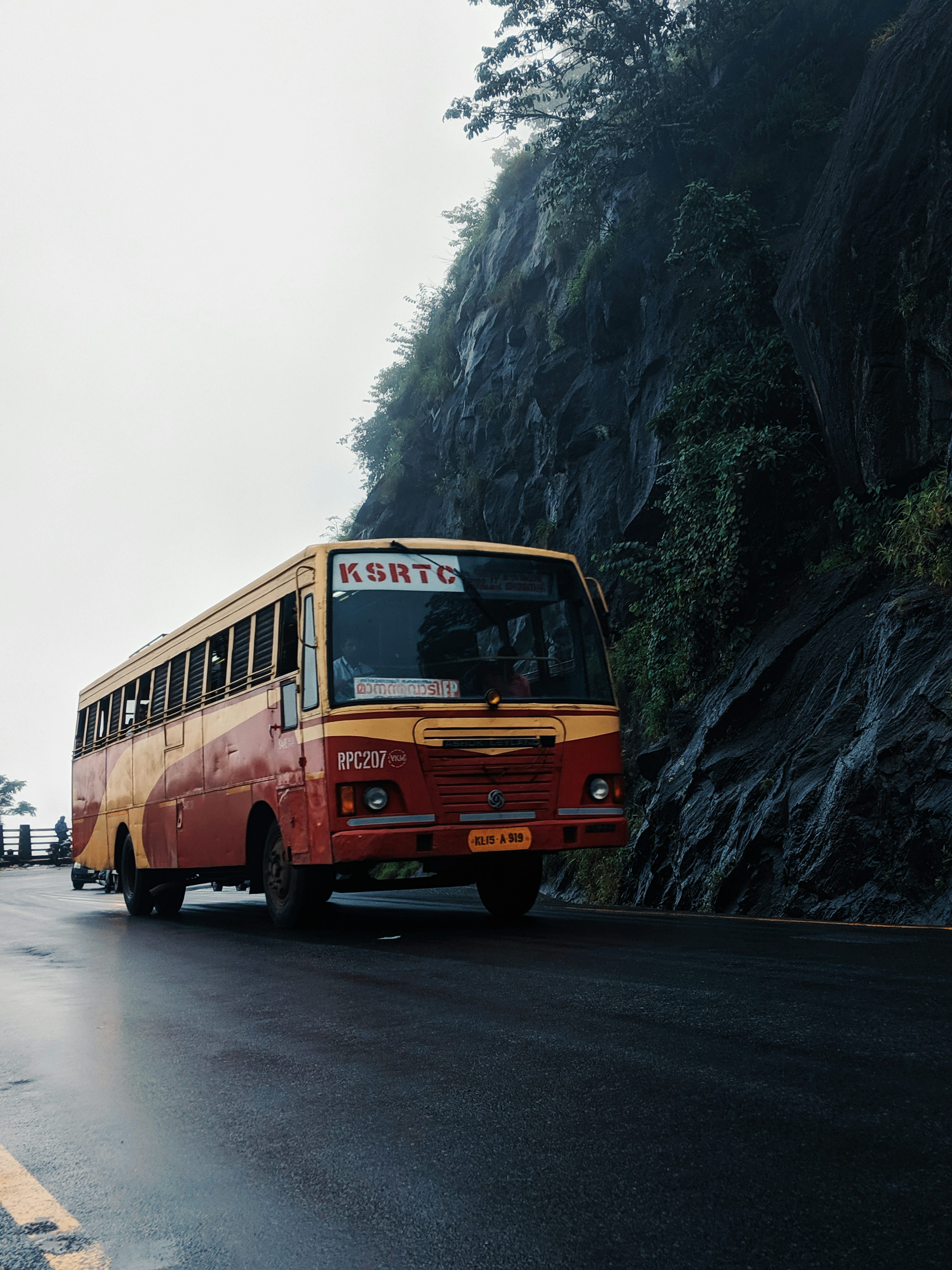 Brown and beige bus on paved road photo