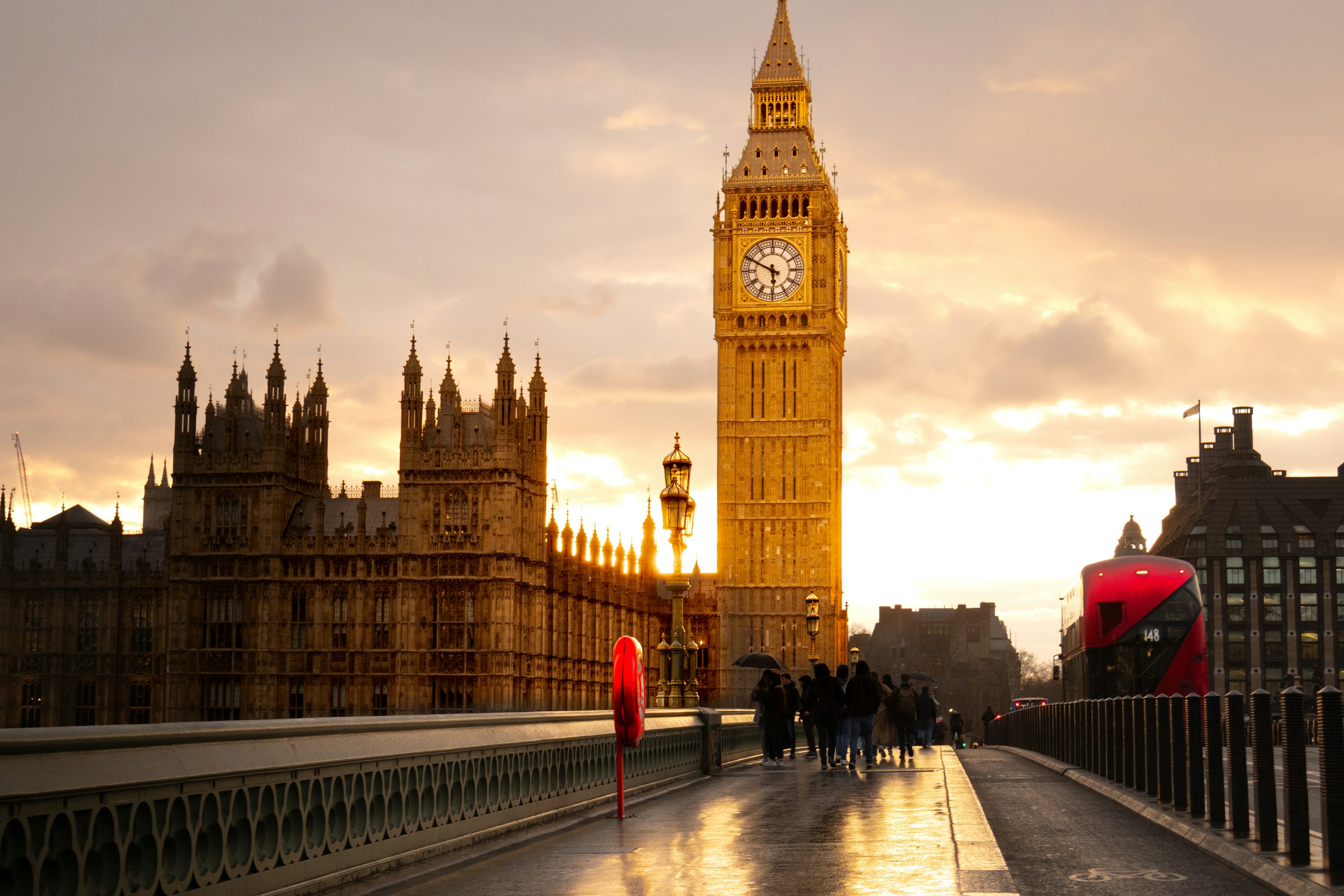 Big ben and parliament are illuminated at sunset. photo