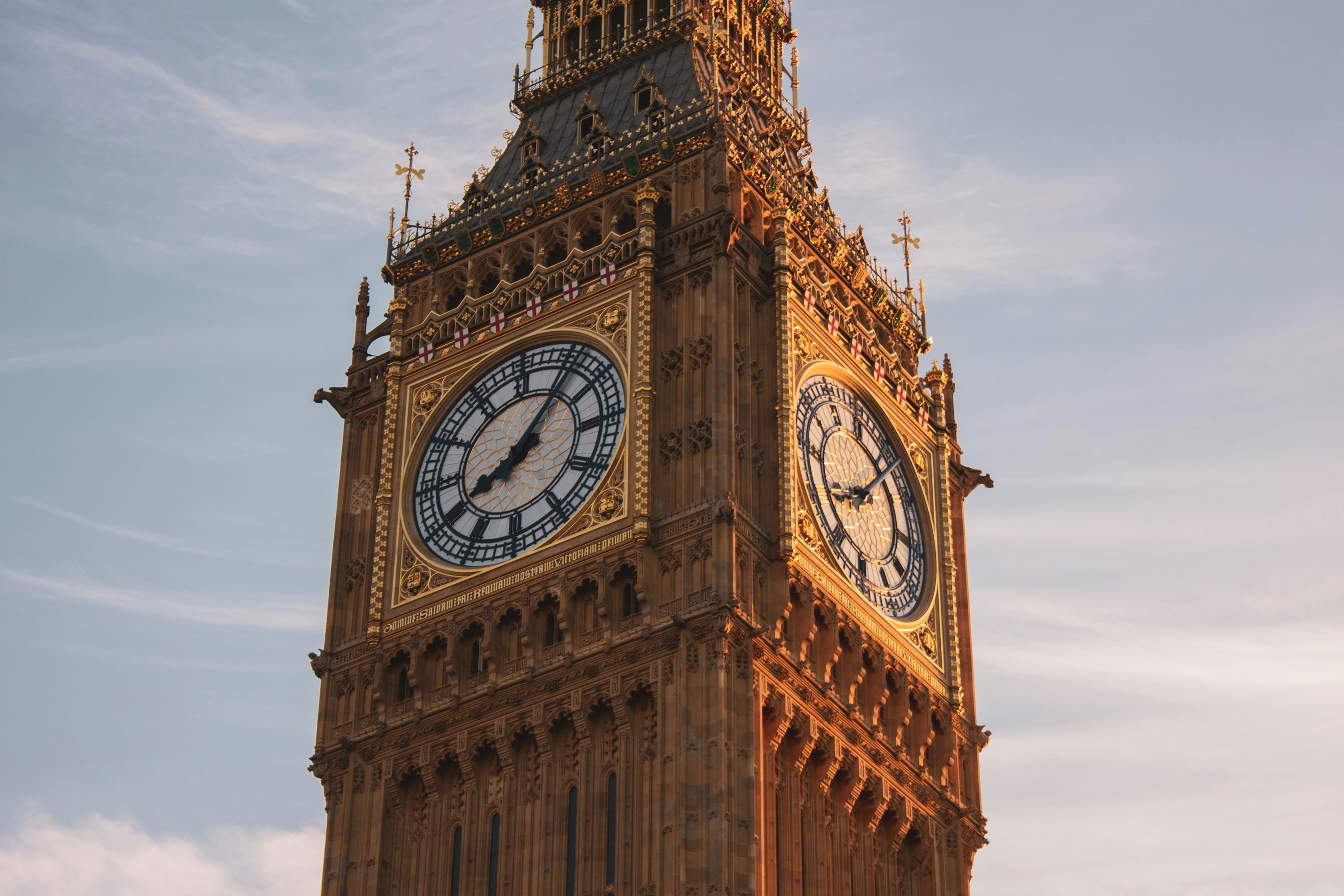 Big ben, london's iconic clock tower, in the sun. photo