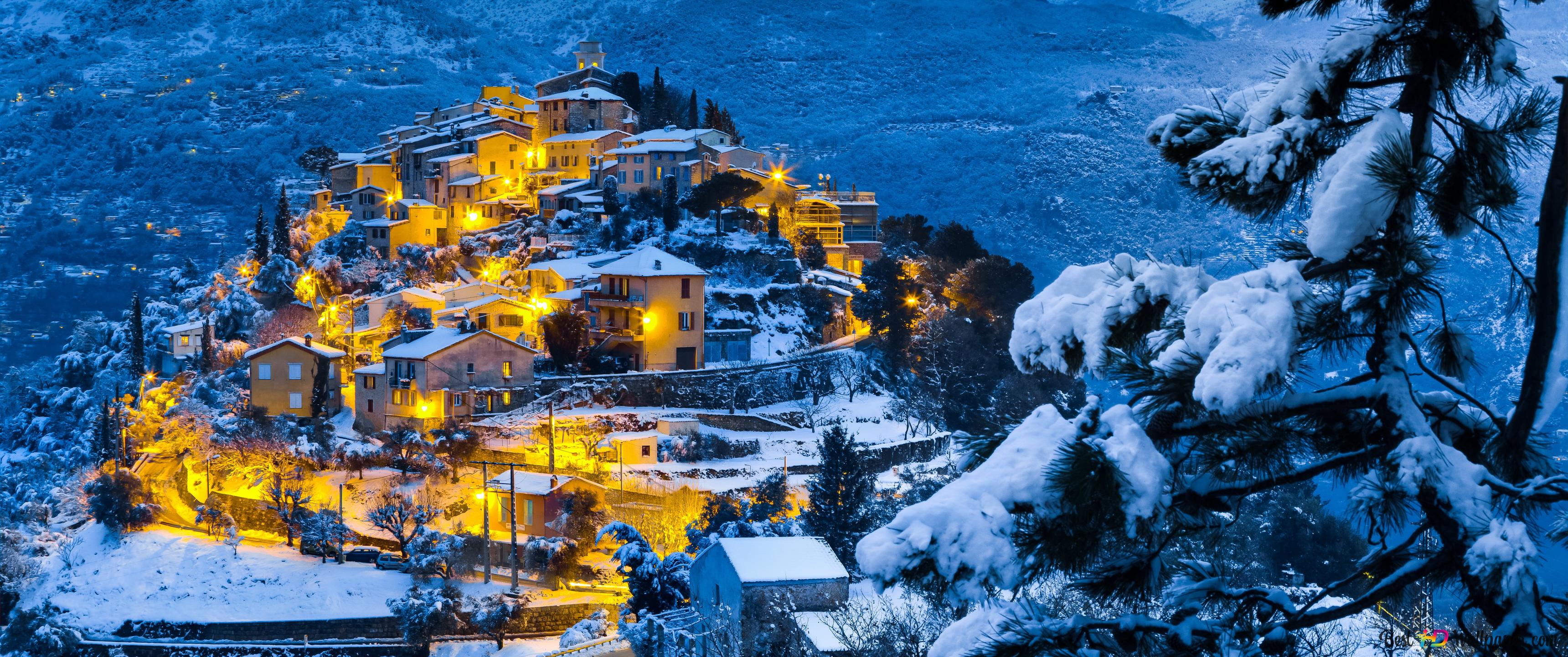 Cozy village on a snowy hill 4K wallpaper download