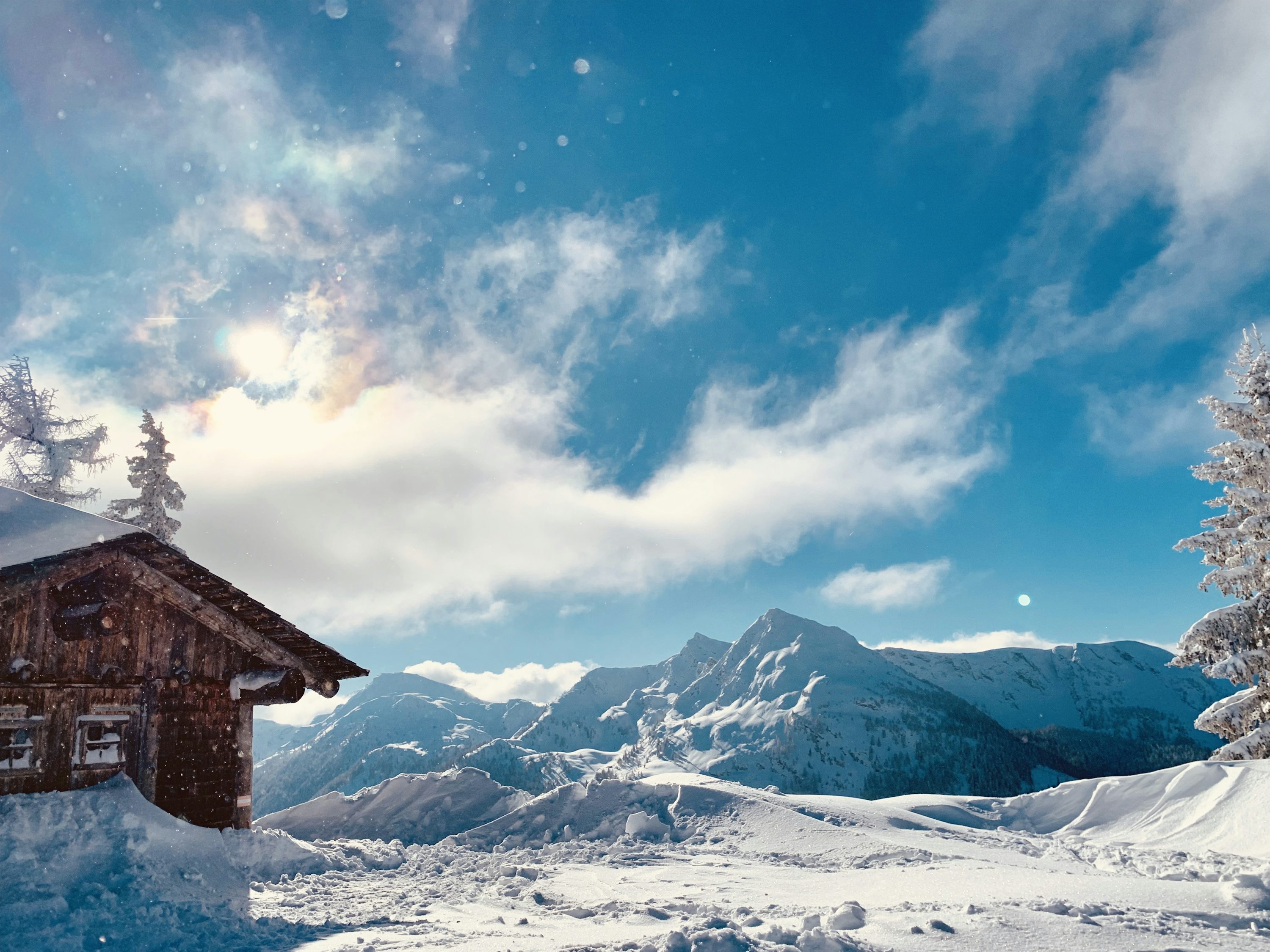 A cabin in the middle of a snowy landscape photo