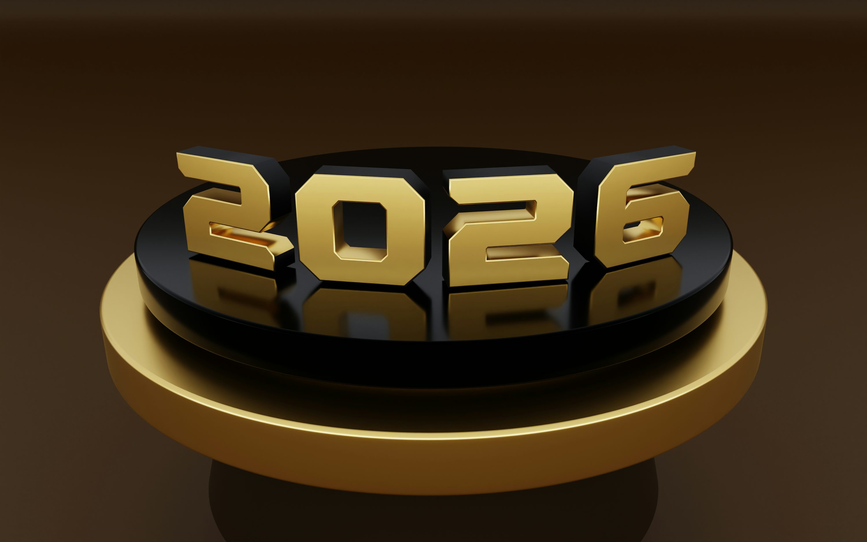 Golden 2026 numbers on a black and gold podium. photo