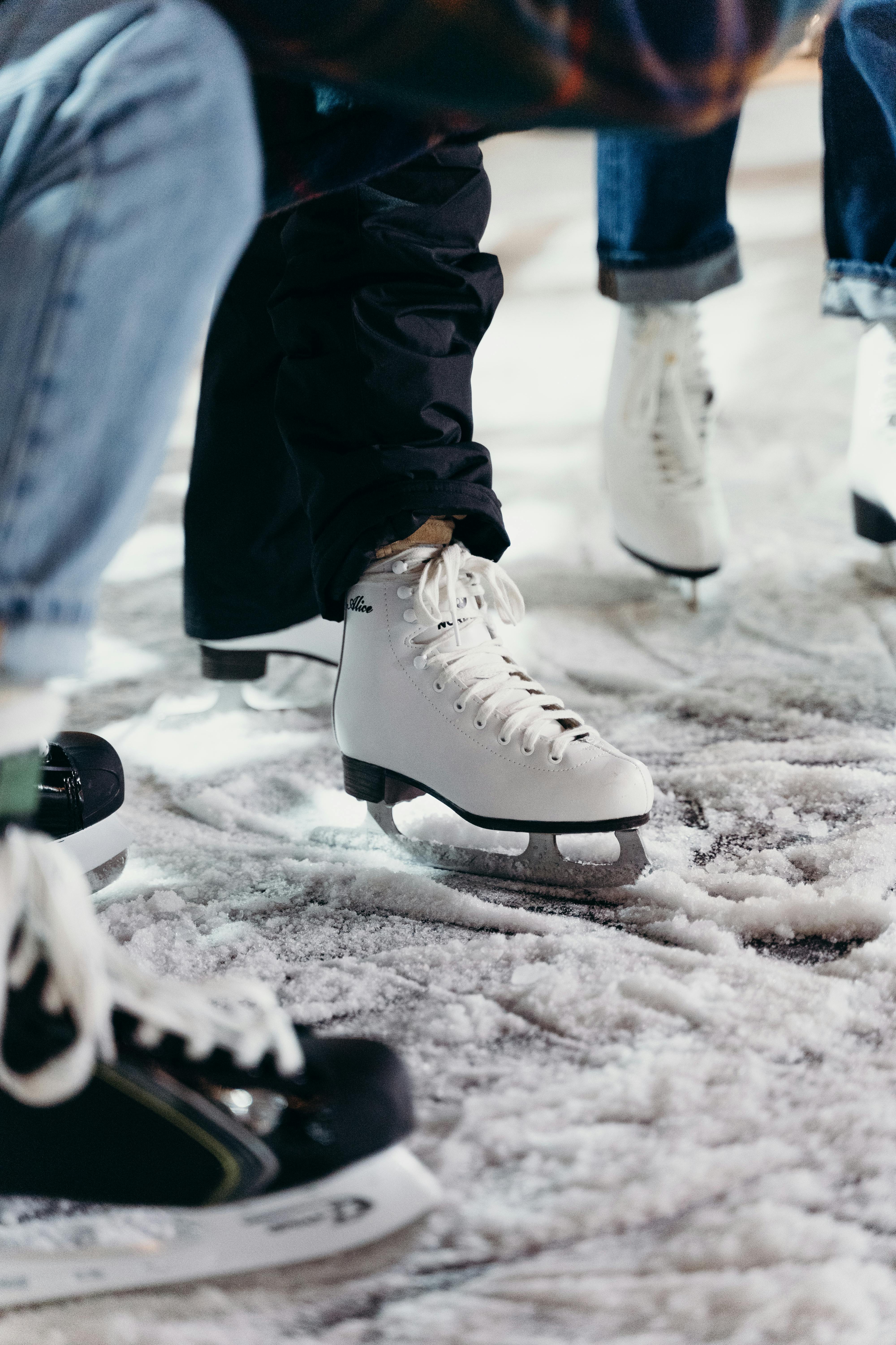 People Wearing White Ice Skating Shoes · Free