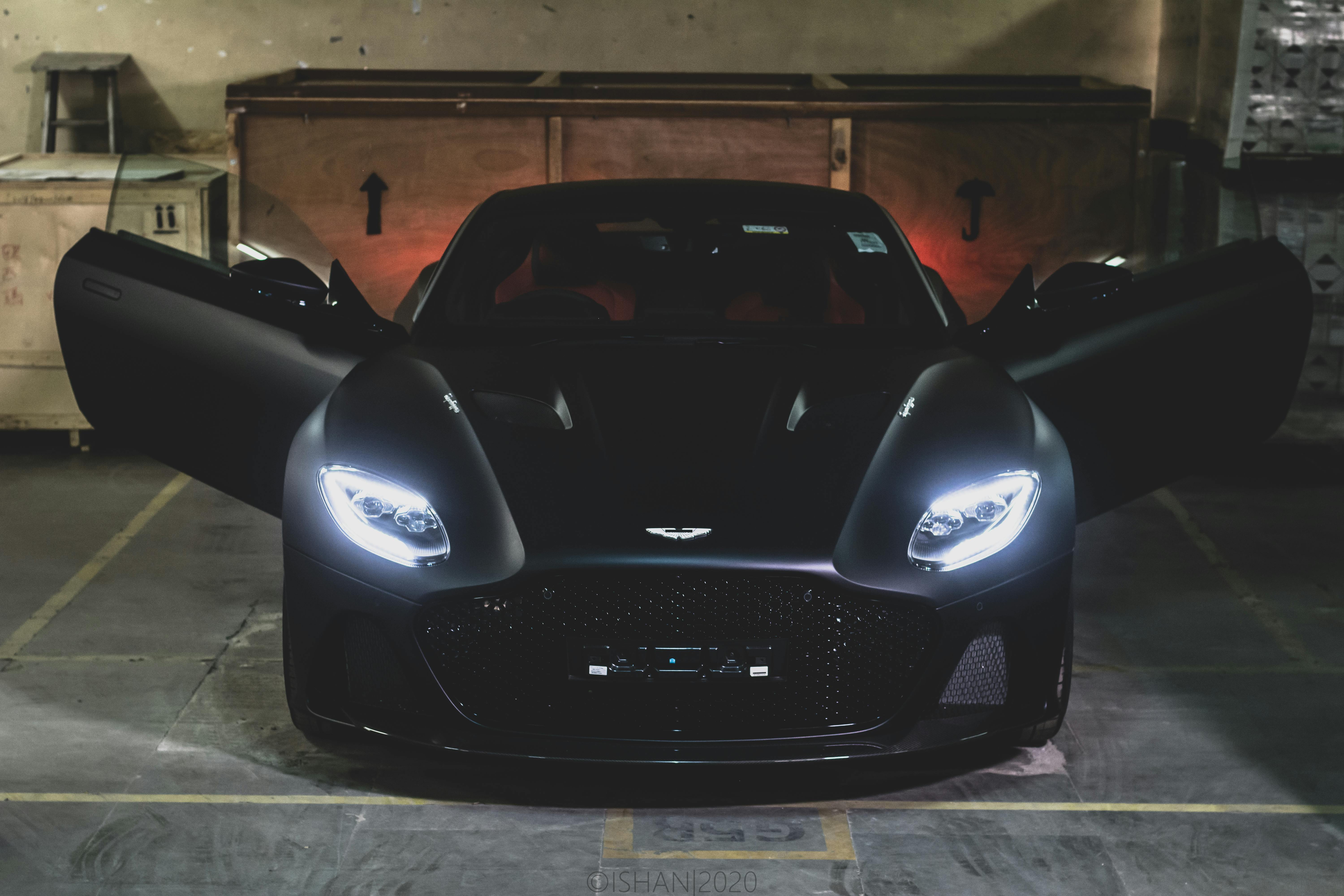 A Black Aston Martin in a Parking Lot · Free