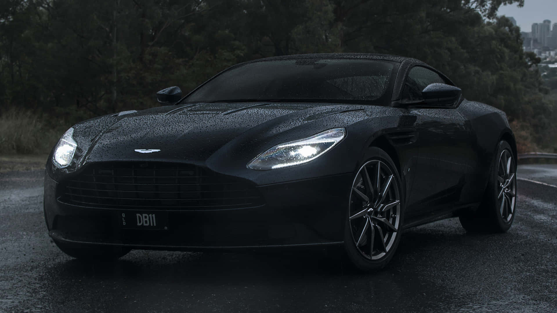 Download Elegant Aston Martin DB11 in Action Wallpaper