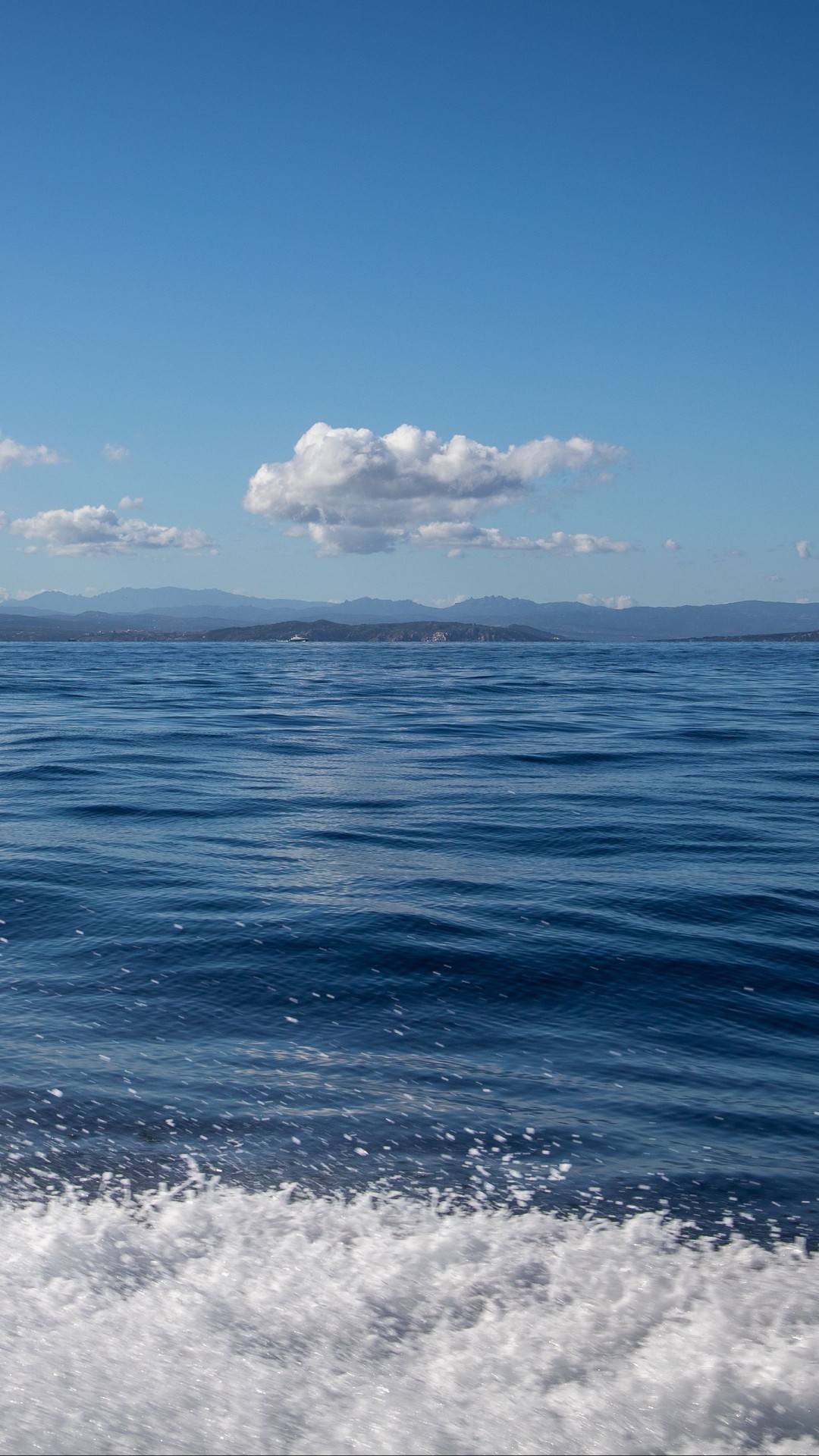 Sea Foam Closeup Water Splashes Clouds Blue Sky Landscape Mountains 4K HD Nature Wallpaper