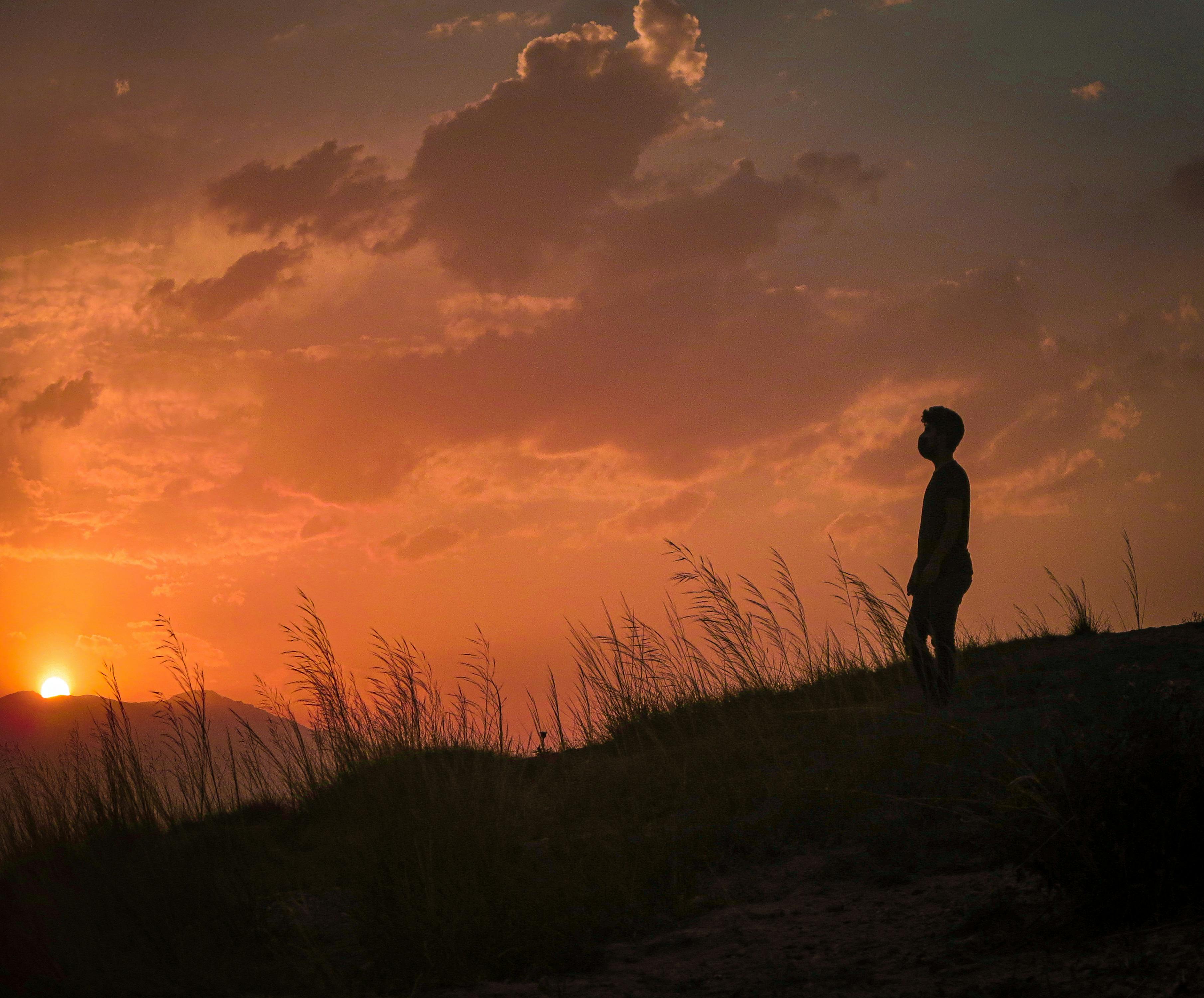 Silhouette of a Boy During Sunset · Free