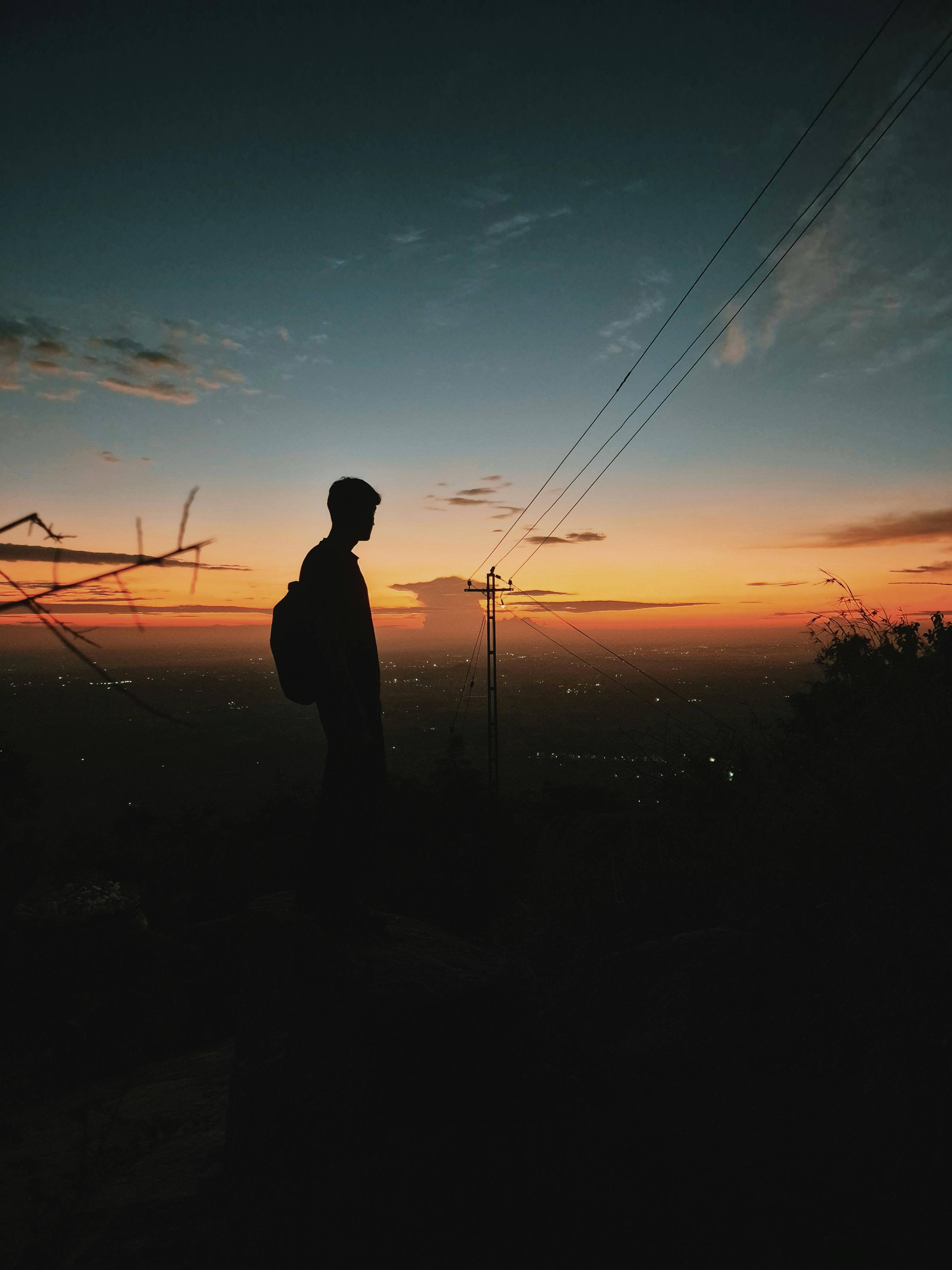 Silhouette of Boy at Sunset · Free