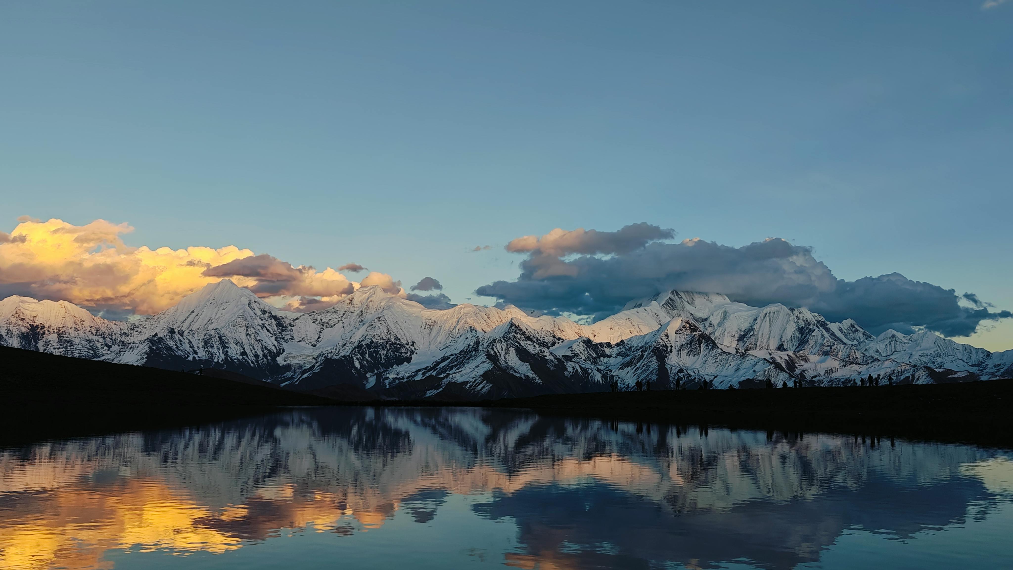 Calm Body of Lake Between Mountains · Free