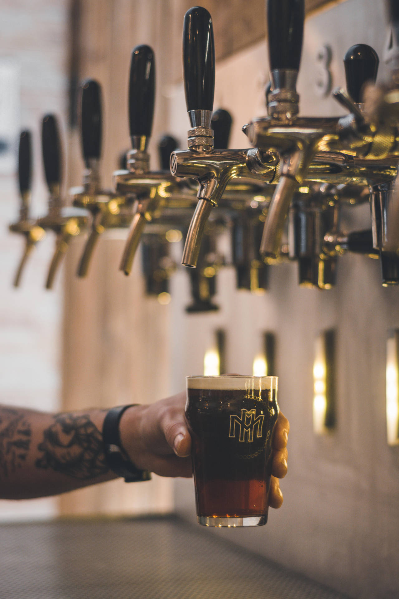 Download Enjoy a cold beer from a keg tap Wallpaper