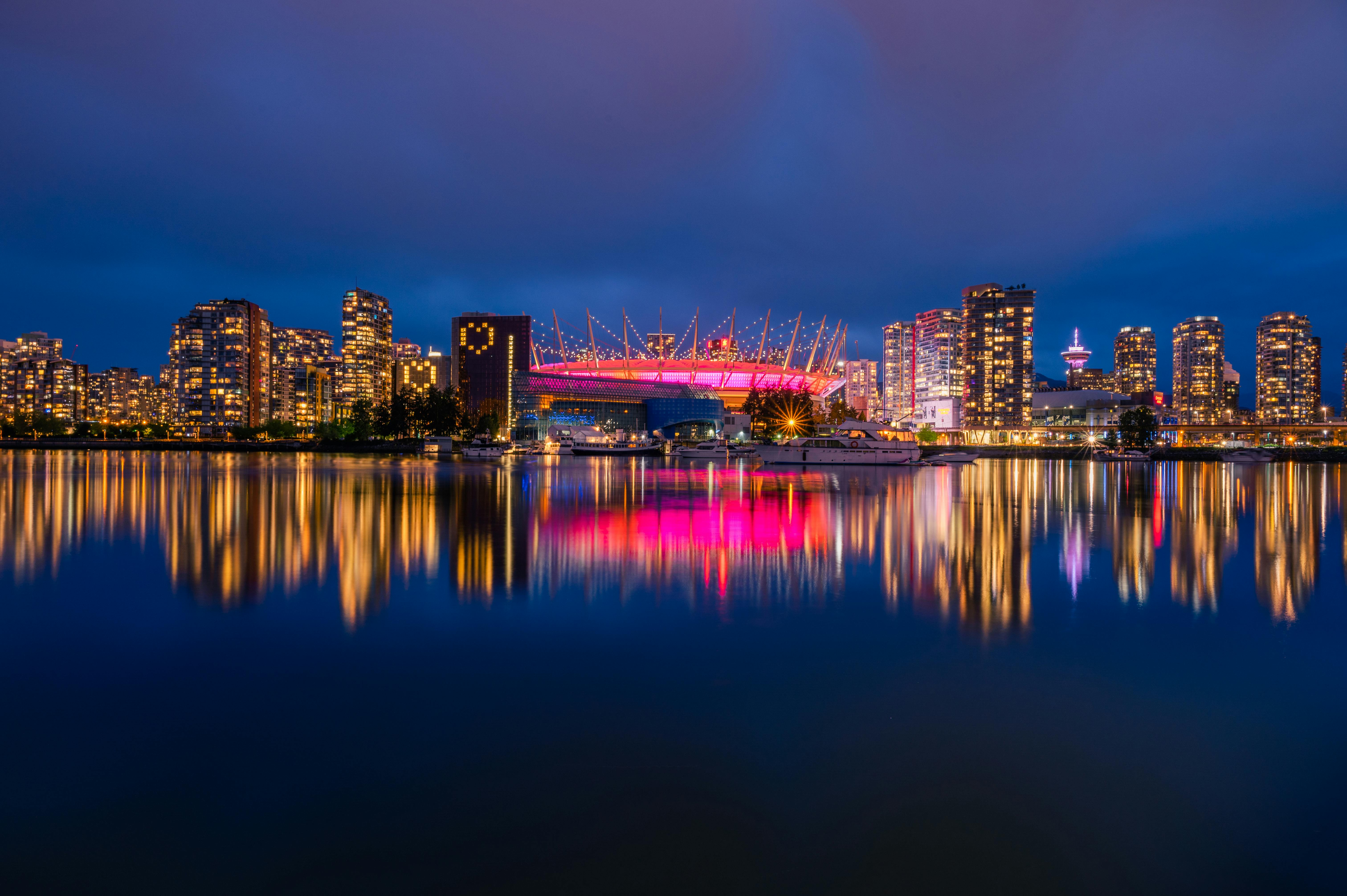 A Scenic View of the BC Place Stadium and Vancouver Skyline at Night · Free