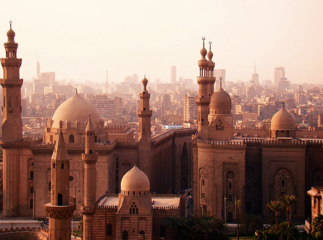The Golden City' Sunset over Sultan Hassan and Al Rifai Mosques in ancient Cairo. View from Salah El Din Citadel