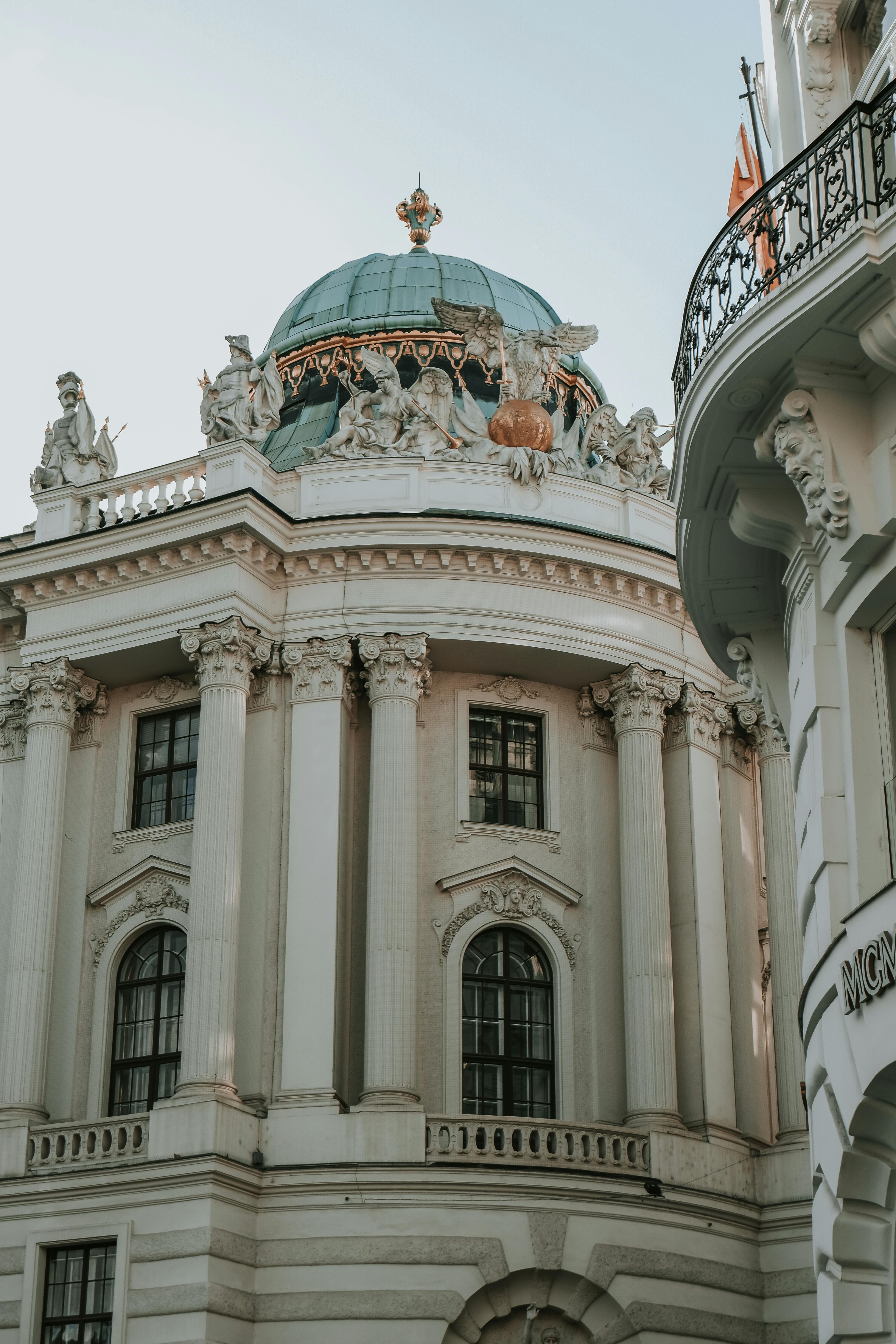 A building with a dome and a clock on top · Free