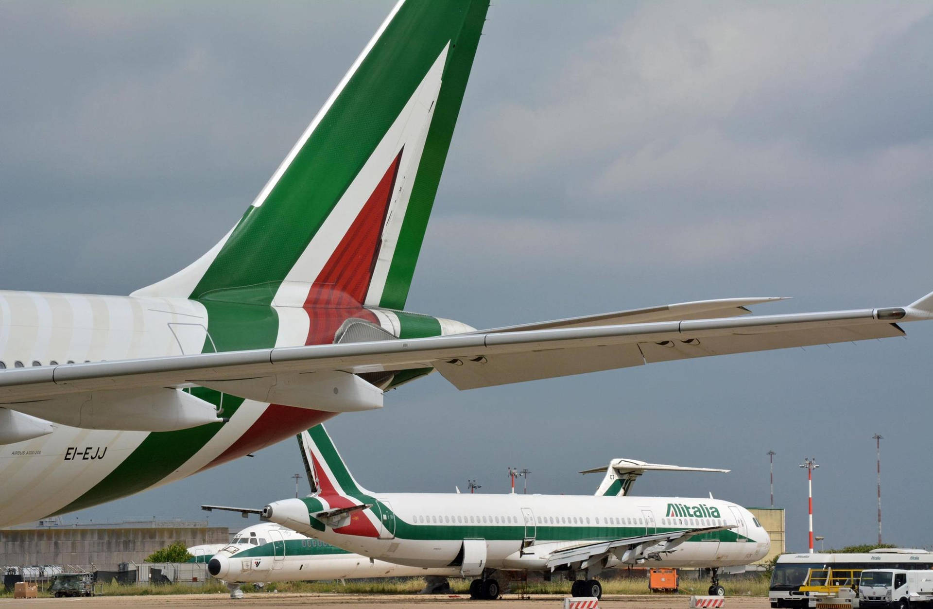 Download Caption: Glimpse of Alitalia's Rudder in Flight Wallpaper