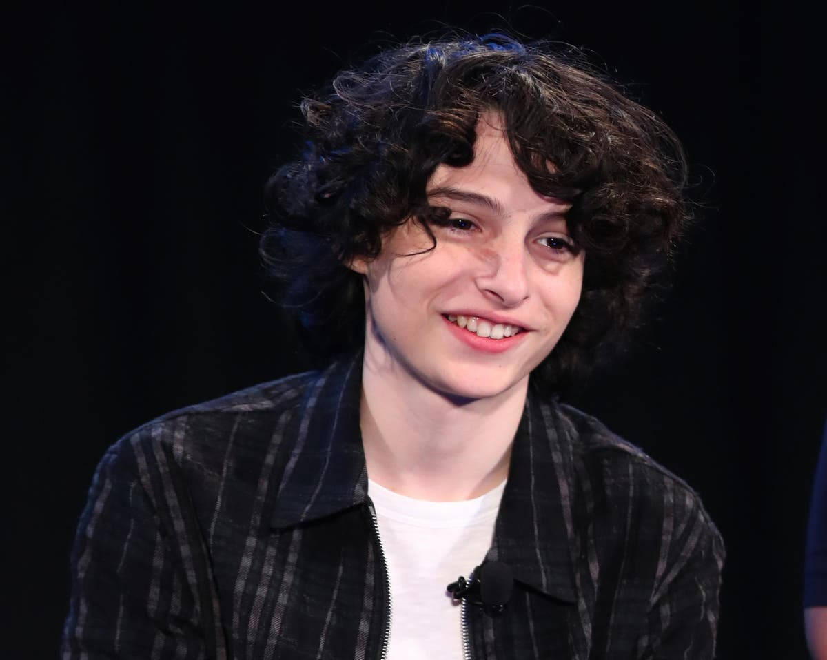 Download Finn Wolfhard On Stage Wallpaper
