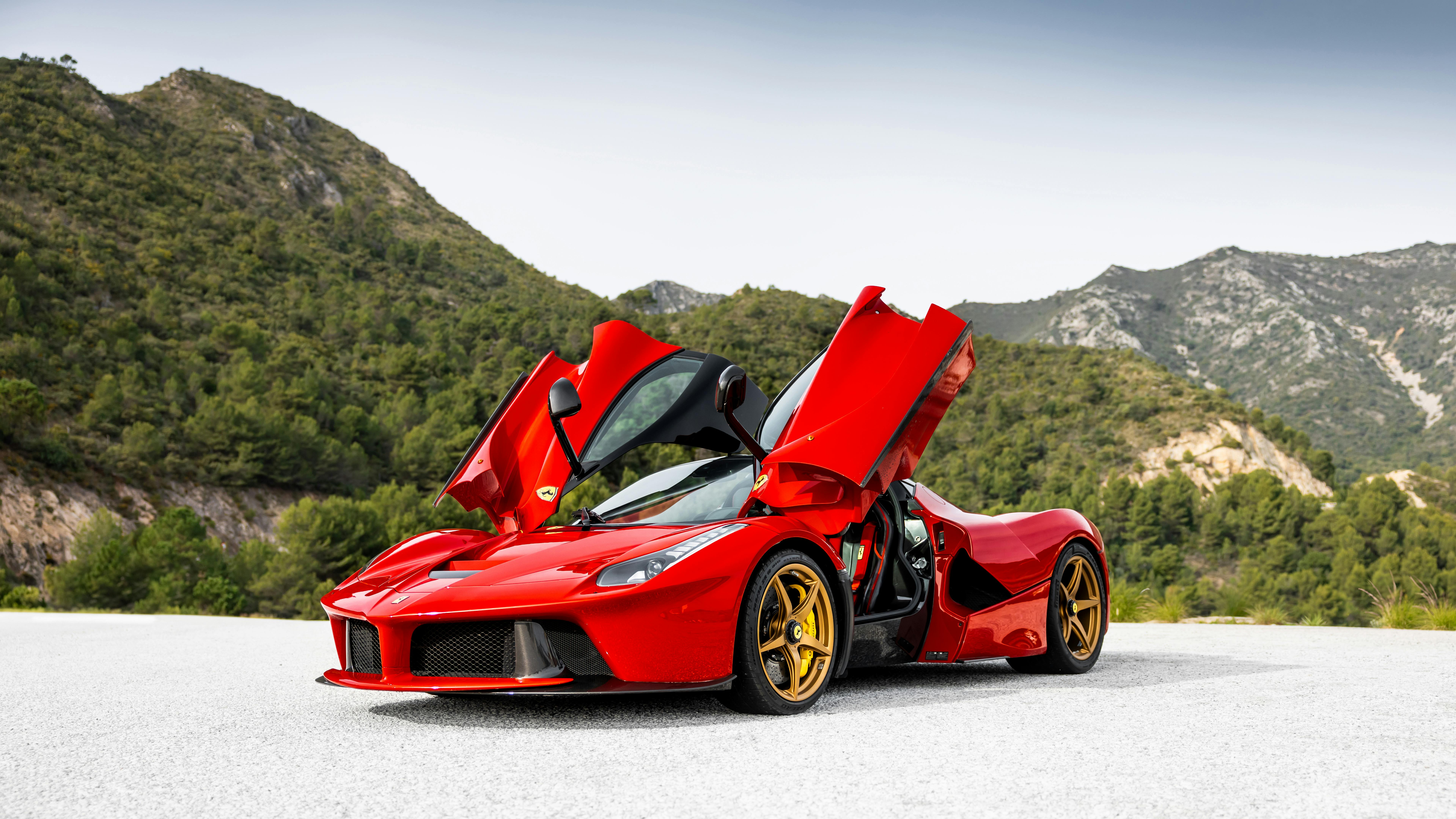 Vibrant Red Sports Car in Scenic Mountain View · Free