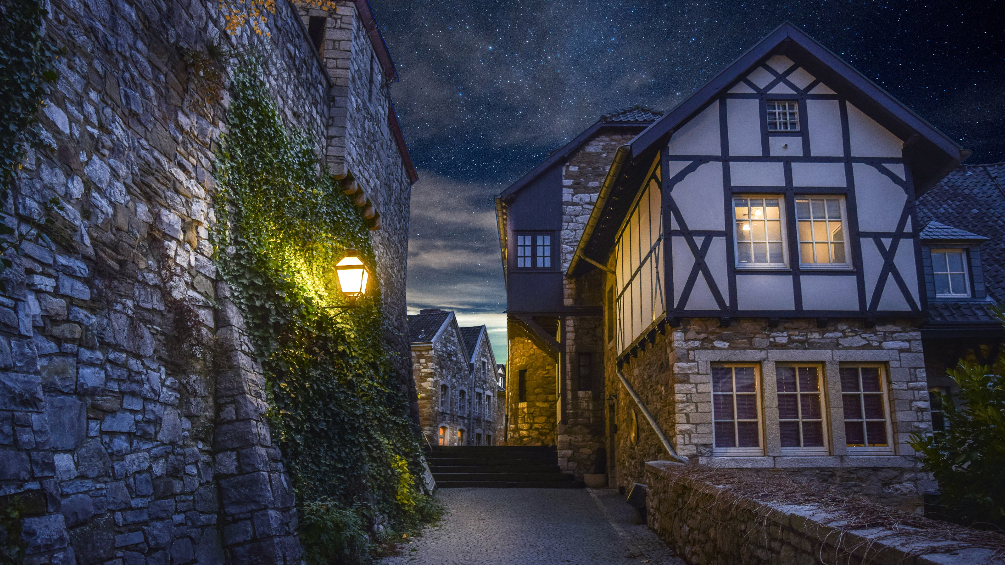 Beautiful Houses With Lights Under Starry Sky During Nighttime 4K HD HD Nature Wallpaper