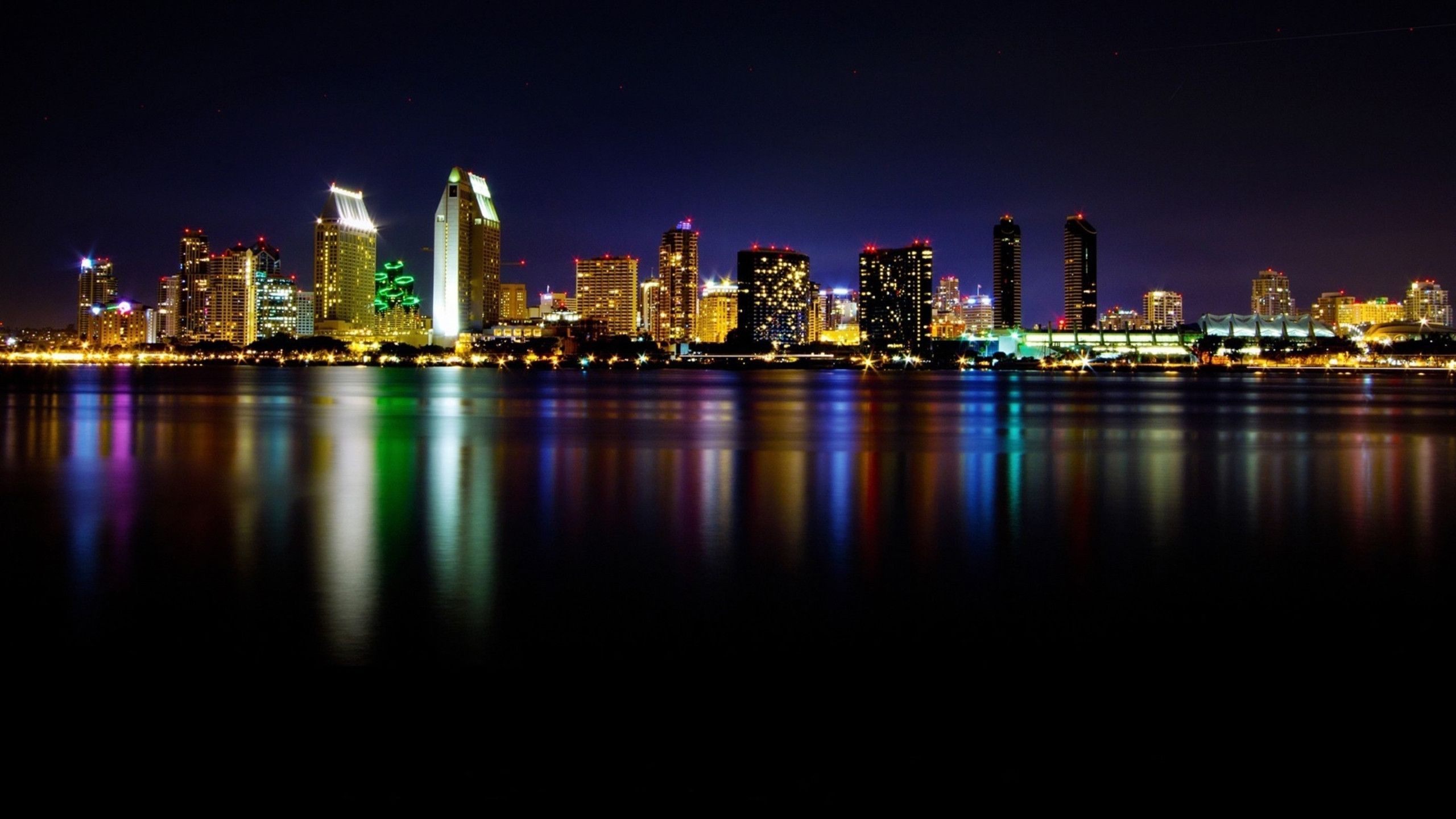 Wallpaper City Skyline Across Body of Water During Night Time, Background Free Image