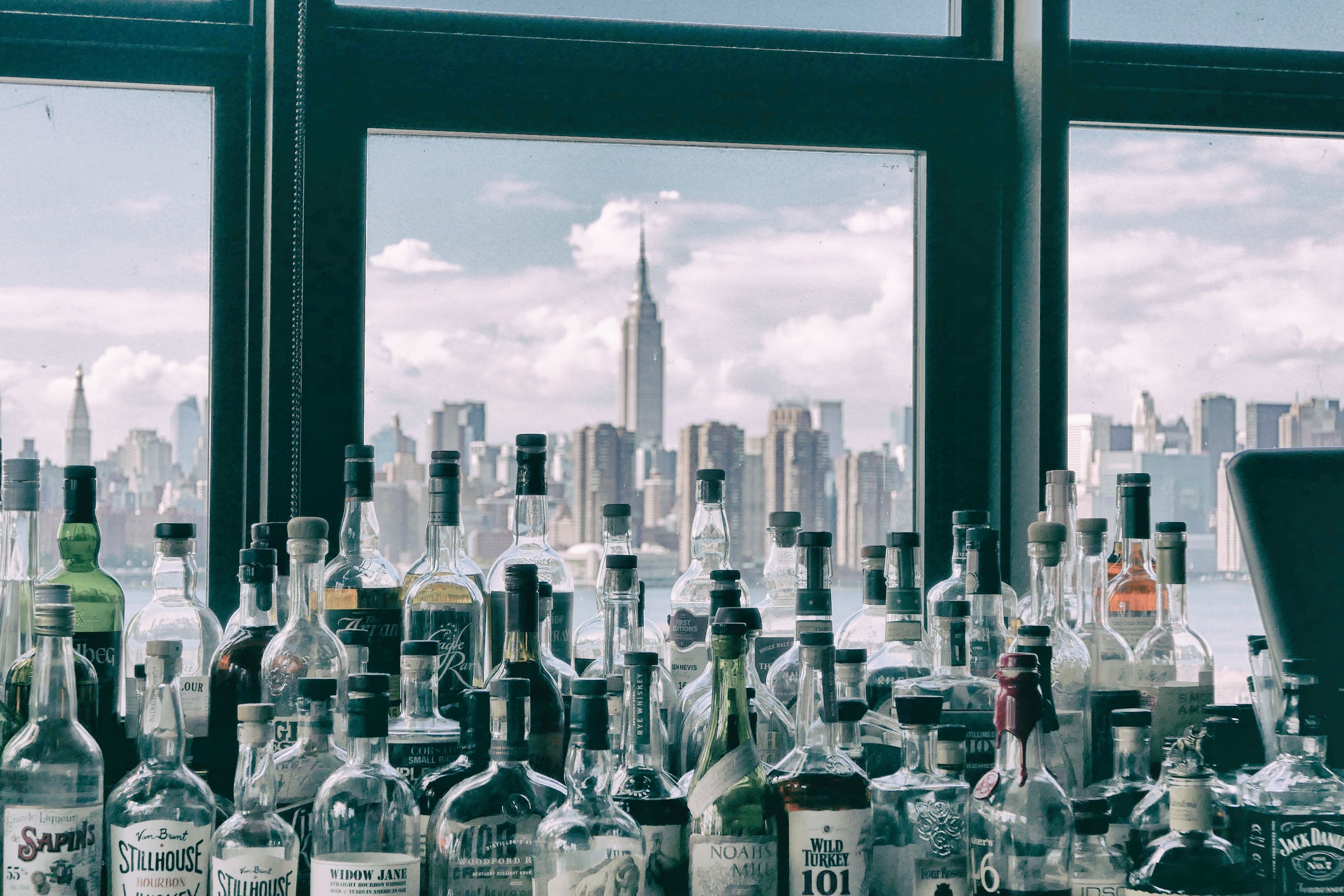 Free Image, water, urban area, cityscape, city, metropolitan area, metropolis, human settlement, daytime, glass bottle, drink, skyline, skyscraper, alcohol, architecture, distilled beverage, building, tower block, downtown, window, Transparent