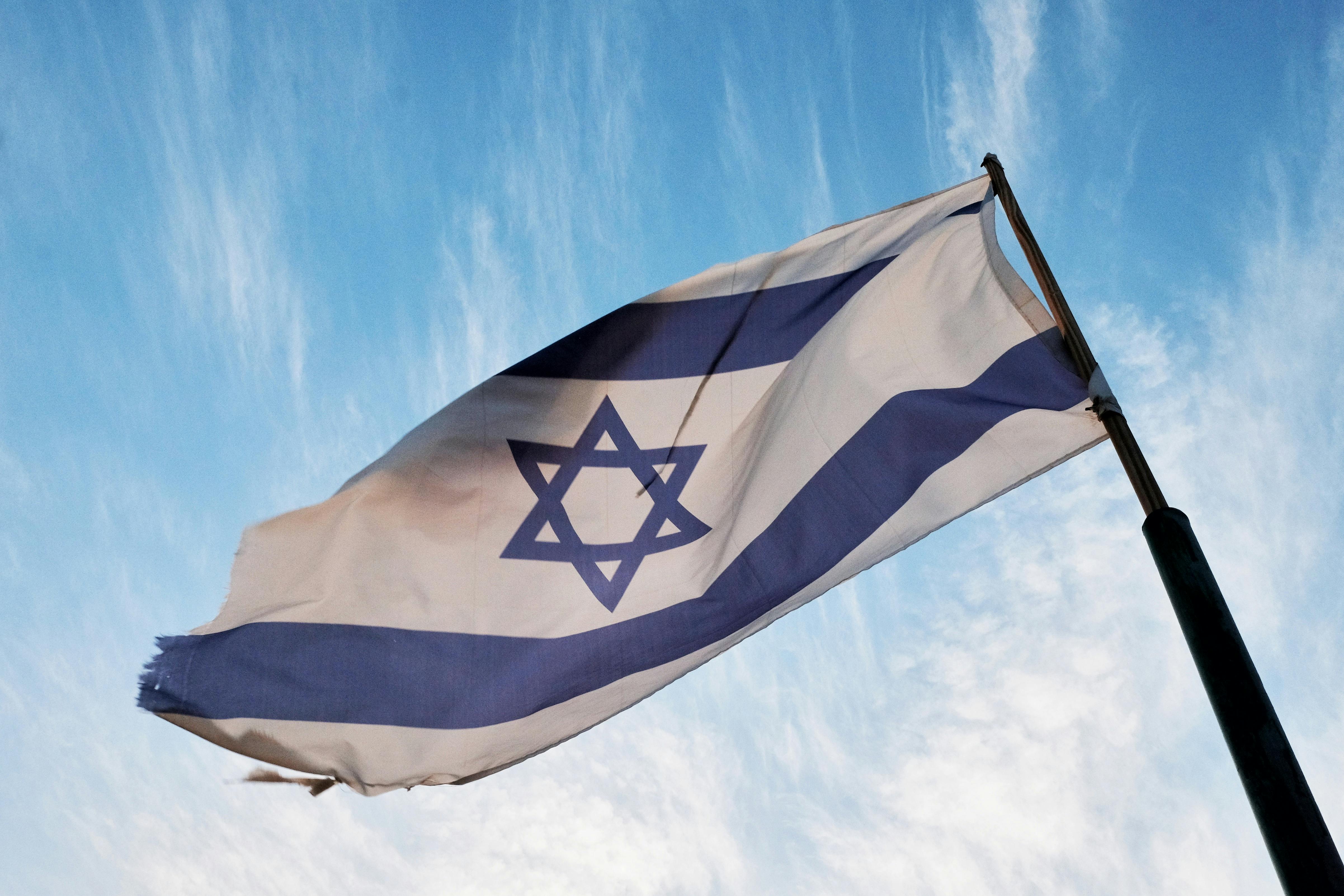Flag of Israel on White Pole Under Blue Sky · Free
