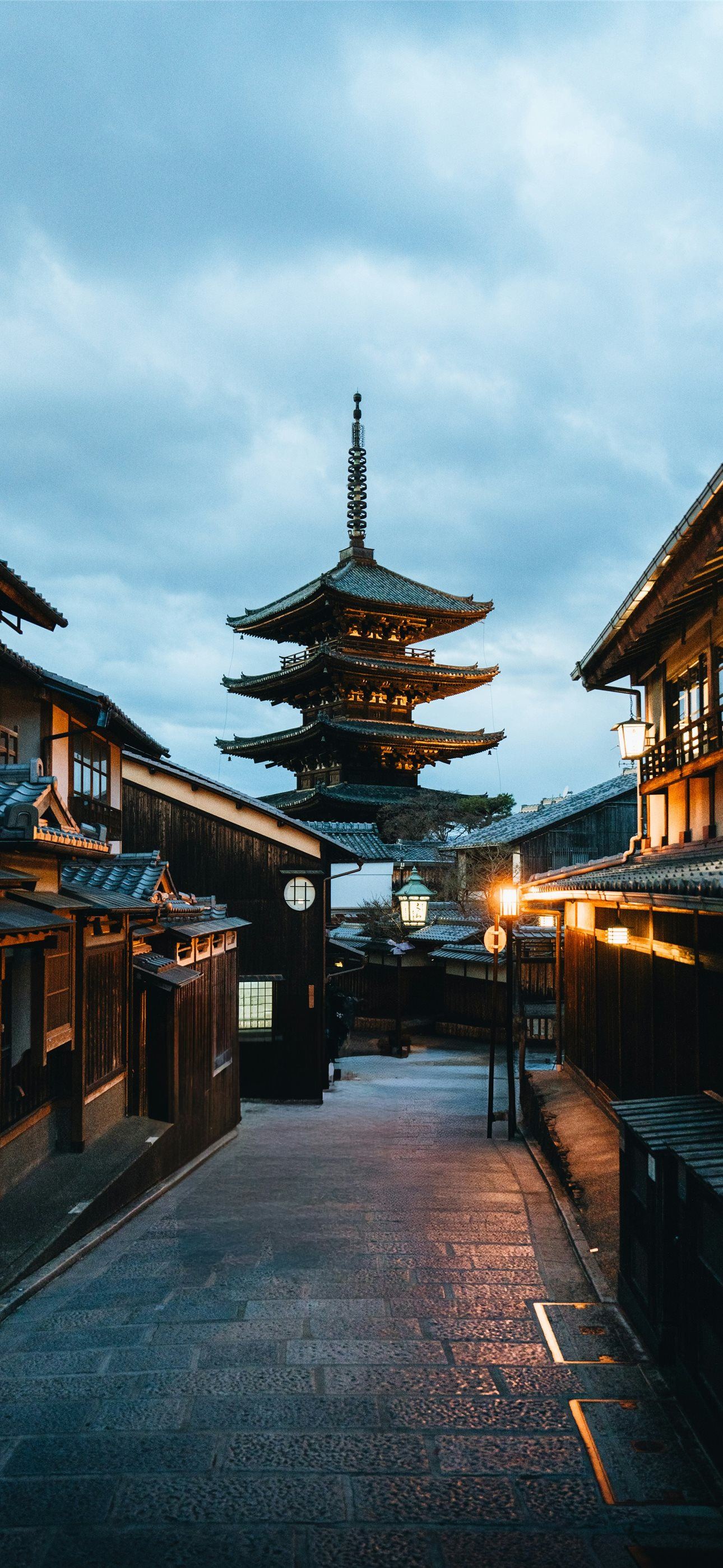 A temple stands tall in a japanese street iPhone Wallpaper Free Download
