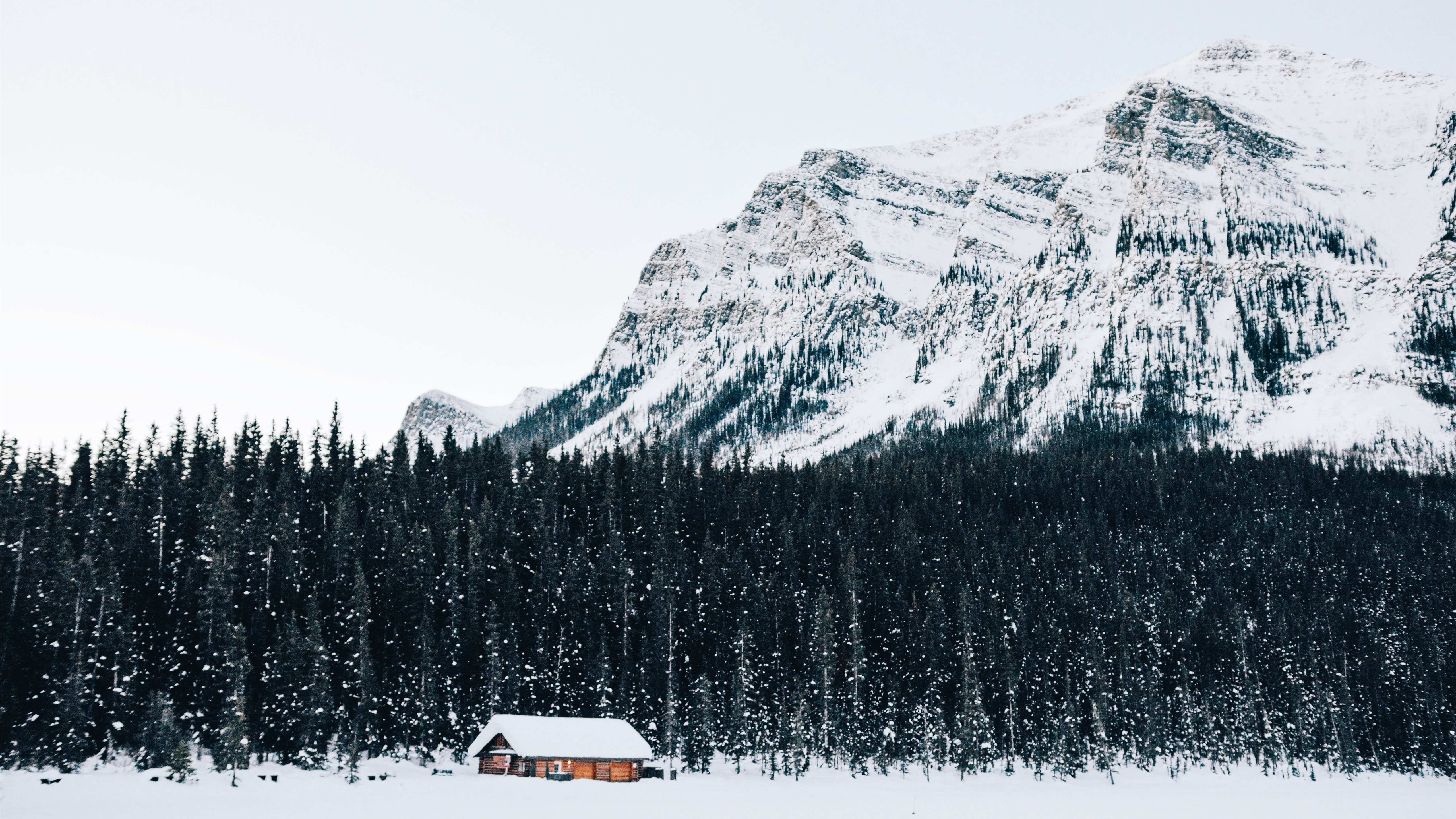 snow covered cabin near forest MacBook Air Wallpaper Download