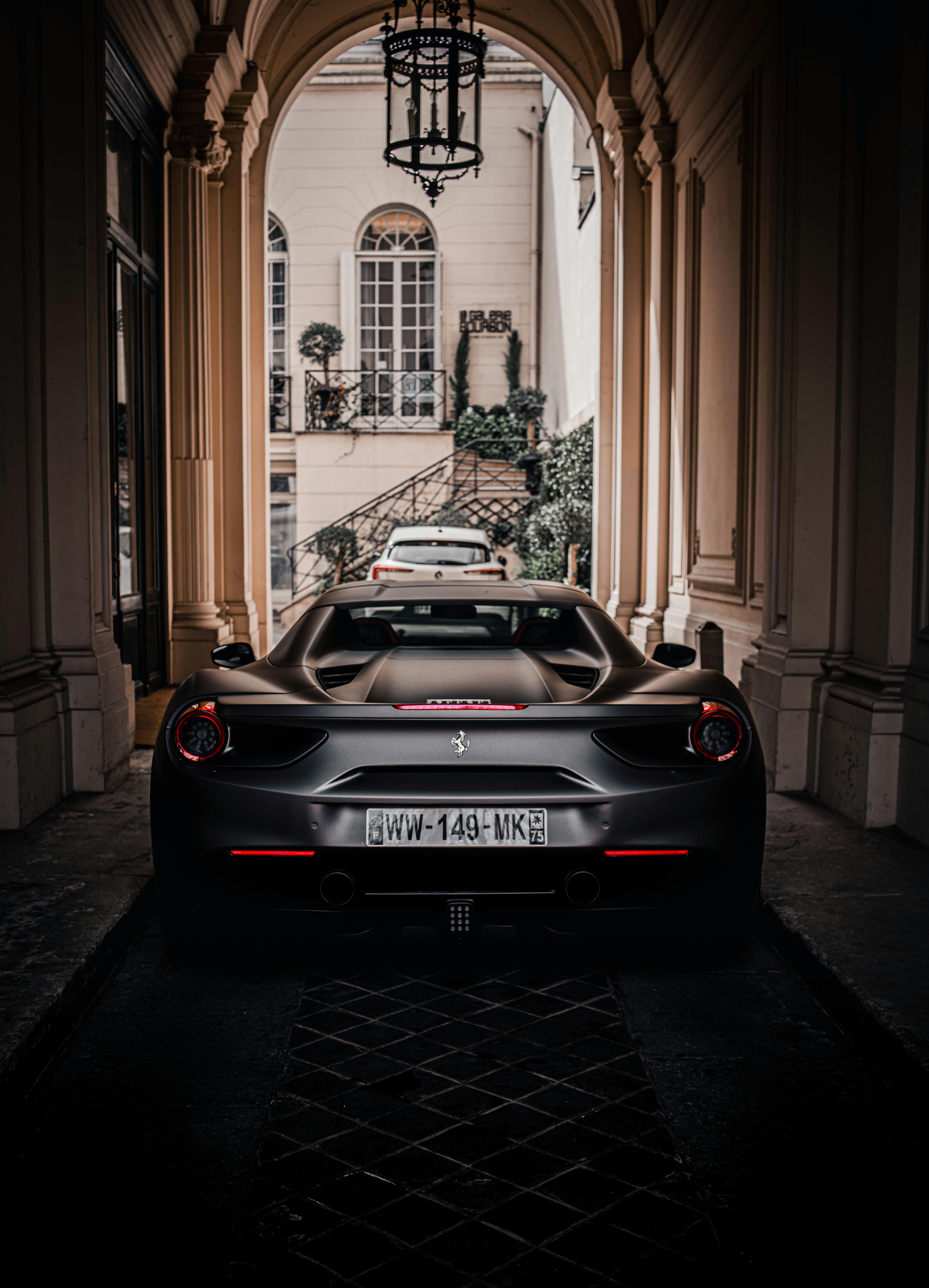 Back of a Ferrari 488 GTB Parked under an Archway · Free